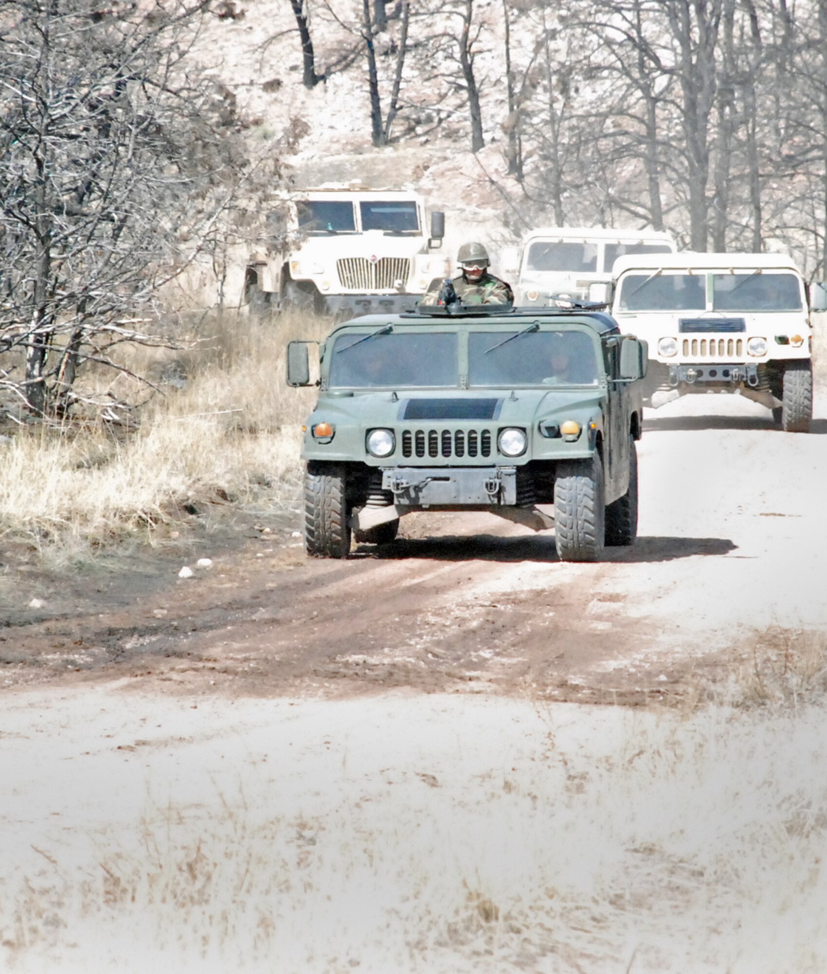 Members of Camp Guernsey’s regional training center train for convoy tactics during an exercise March 13. There were 98 students from 29 wings attending the pre-deployment training (U.S. Air Force photos/Airman 1st Class Alex Martinez).