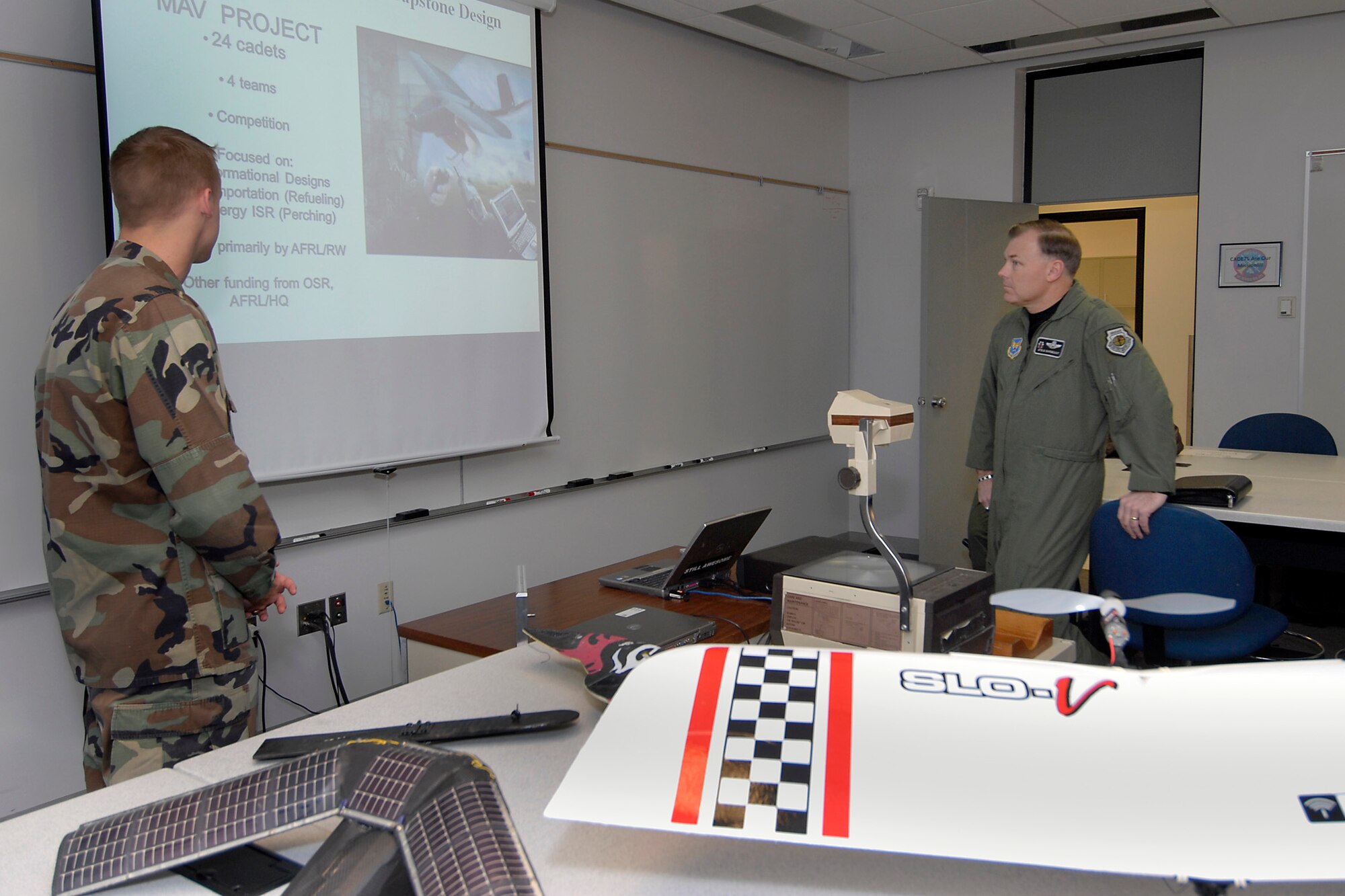 (Right) Maj. Gen. Stephen T. Sargeant, Air Force Operational Test and Evaluation Center Commander, listens to a U.S. Air Force Academy cadet's Captone briefing during a March 17, 2008 visit to the Academy.