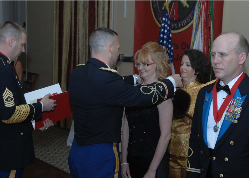 SHAW AIR FORCE BASE, S.C. -- Sgt. Maj. Paul Wyland and Col. Kevin Felix of the 4th Battlefield Coordination Detachment present the Molly Pitcher Award at the 4th BCD Saint Barbara's Day Ball March 15 at the Sunset Country Club in Sumter, S.C. (U.S. Air Force photo/Airman 1st Class Matthew Davis)  