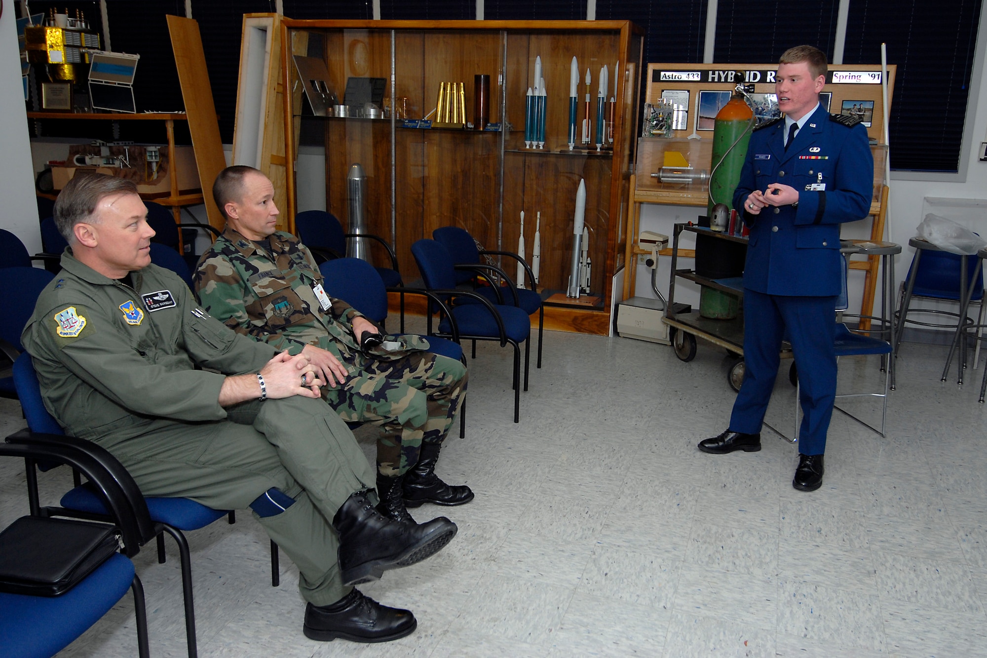 (Left) Maj. Gen. Stephen T. Sargeant, Air Force Operational Test and Evaluation Center Commander, listens to a U.S. Air Force Academy cadet during a Cadet Capstone team briefing.
