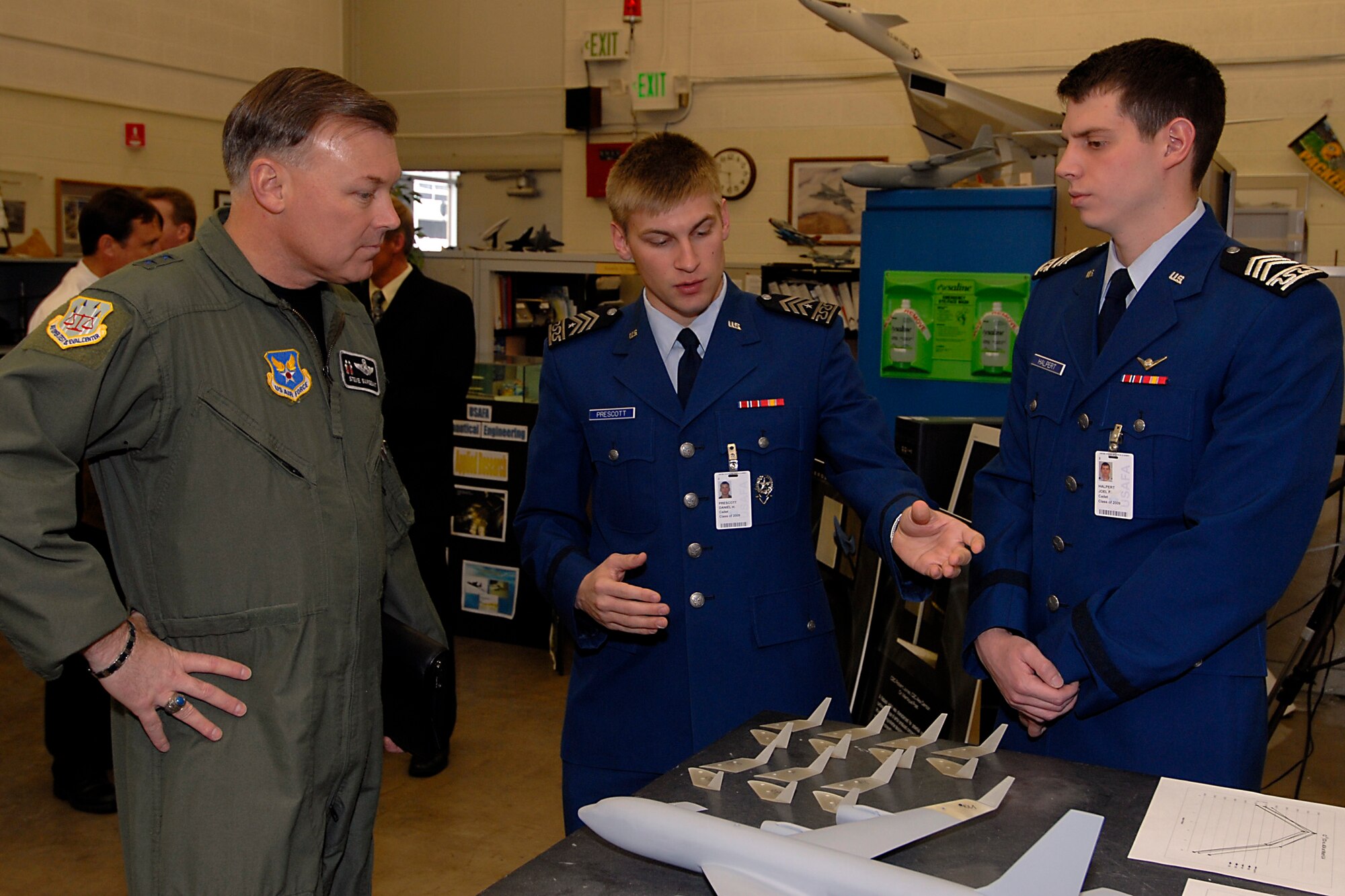 (From left) Maj. Gen. Stephen T. Sargeant, Air Force Operational Test and Evaluation Center Commander, listens as U.S. Air Force Academy cadets explain what they are working on during his tour of Academy astronatutics classes and laboratories on March 17, 2008.
