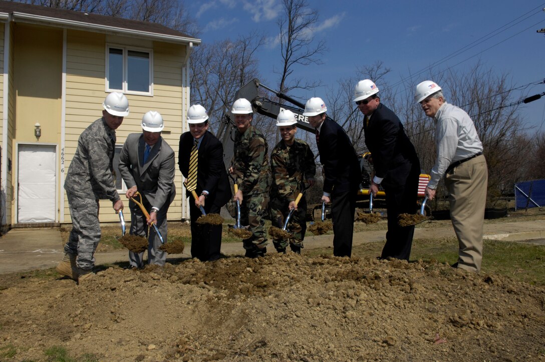 Col Eric Snadecki, 316th Wing Vice Commander, and members of Clark Realty break ground during a ground breaking ceremony on Mar 14. The ground breaking ceremony was for the part of base housing that is being renovated. The project is going to take approximately 1.5 years and will include the construction of 134 new homes to include three and four bedrooms for the enlisted personnel living on base.  (US Air Force/SrA Renae Kleckner)