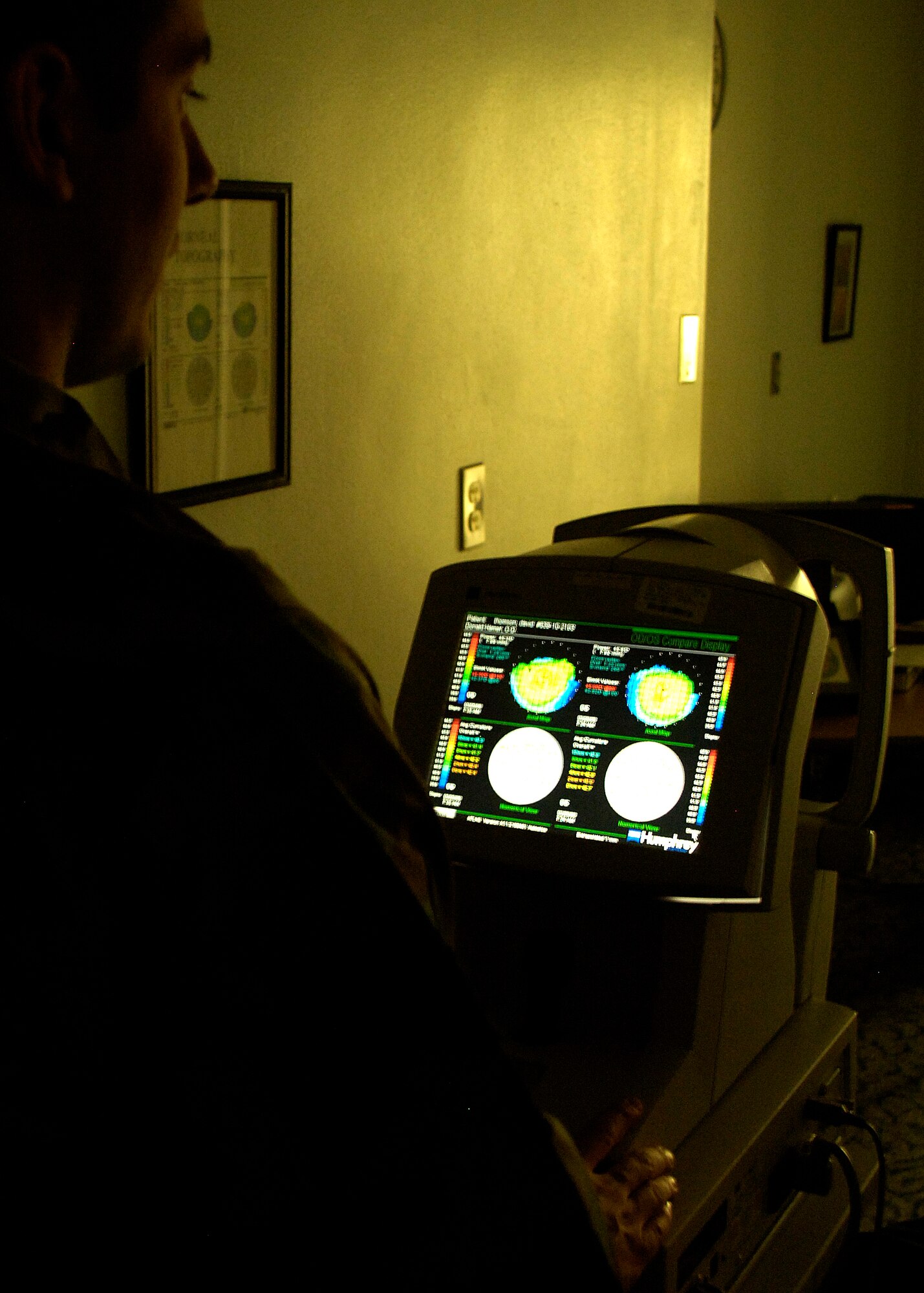 Senior Airman Anthony Hayner, 49th Aeromedical-Dental Squadron ophthalmic technician, uses a corneal topographer to map the surface curvature of the cornea at Holloman Air Force Base, N.M., March 20, 2008. (U.S. Air Force photo/Airman 1st Class Michael Means)