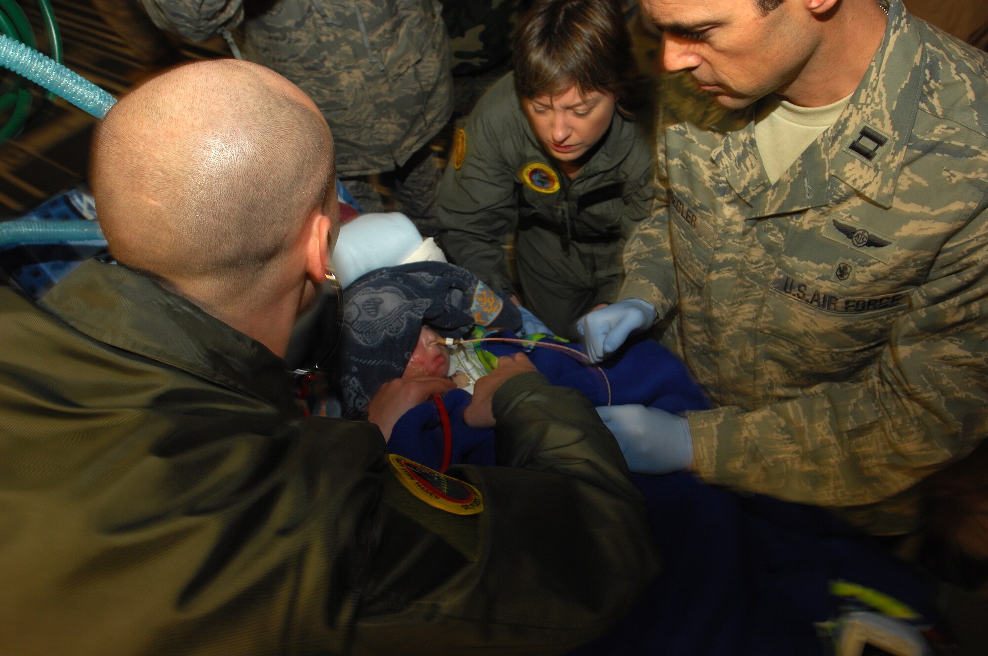A three-year-old Iraqi burn victim is kept under a watchful eye after flying from Balad Air Base, Iraq to Ramstein on an Aero Medical Evacuation flight. The Iraqi child and his mother will continue on to the states where he will receive further treatment. Photo by Airman 1st Class Kenny Holston*