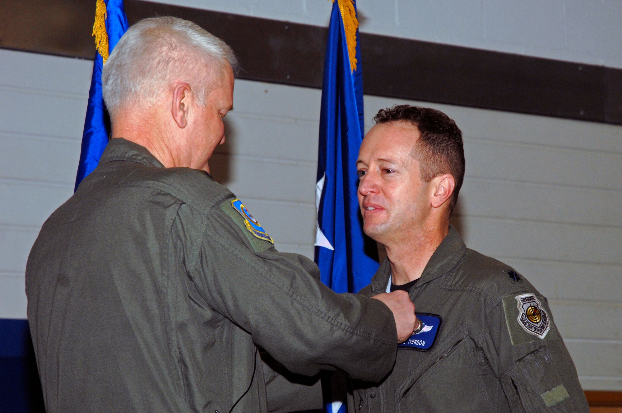 Lt. Gen. Robert D. Bishop Jr., 3rd Air Force commander, presents Lt. Col. David Iverson, 492nd Fighter Squadron, with a Bronze Star medal during an Airmen’s Call March 19 at RAF Lakenheath, England. Colonel Iverson earned the Bronze Star for efforts supporting Operation Iraqi Freedom. (U.S. Air Force photo by Airman Perry Aston)