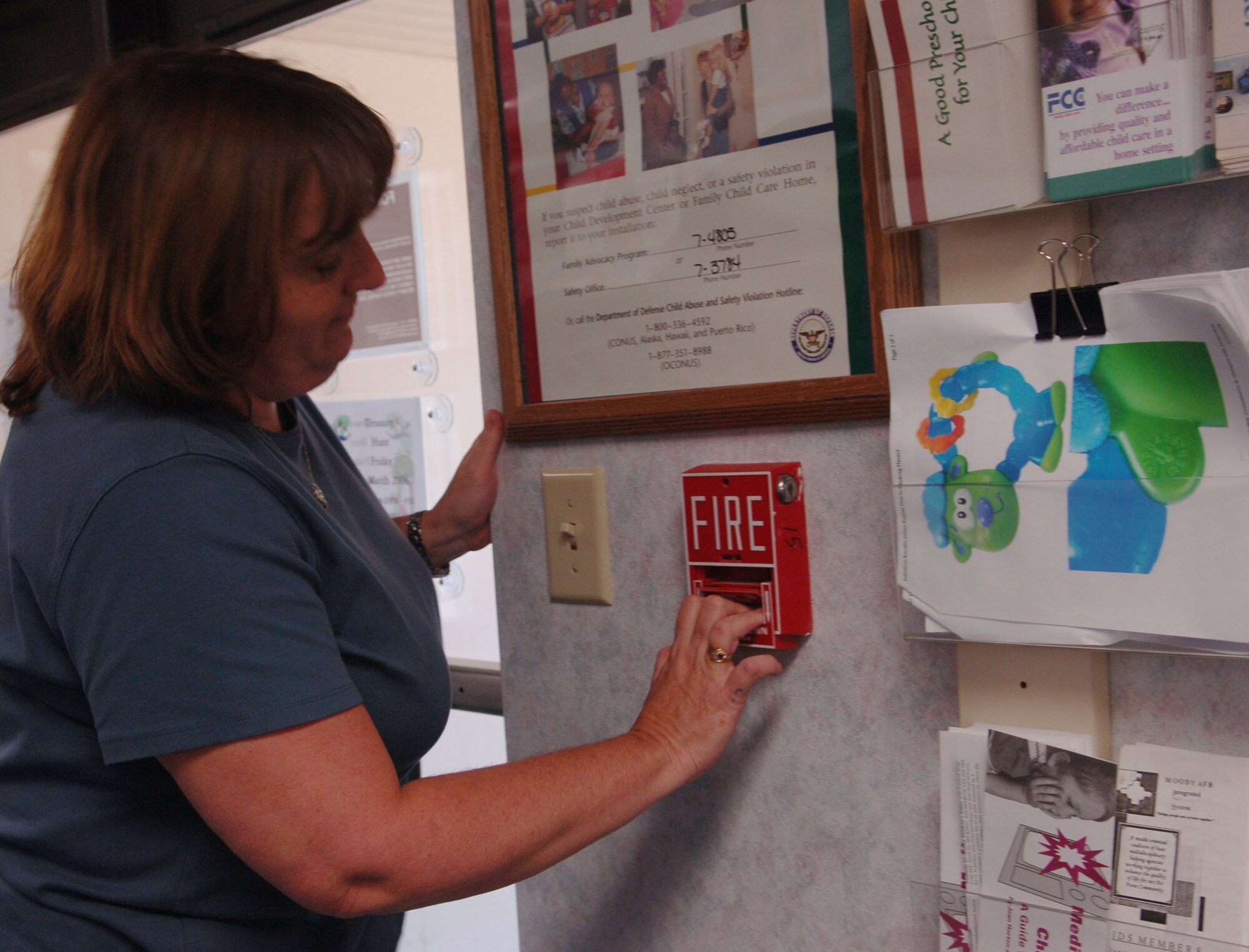 MOODY AIR FORCE BASE, Ga – Donna Burgess, 23rd Wing Child Development Center desk clerk, pulls the fire alarm in response to a fire drill here Mar 20. The CDC has a monthly fire drill where they are tested on the ability to evacuate the building as quickly as possible. They received a perfect score this month for completing the checklist and evacuating the building in less than two minutes. (U.S. Air Force Photo by Senior Airman Schelli Jones)
