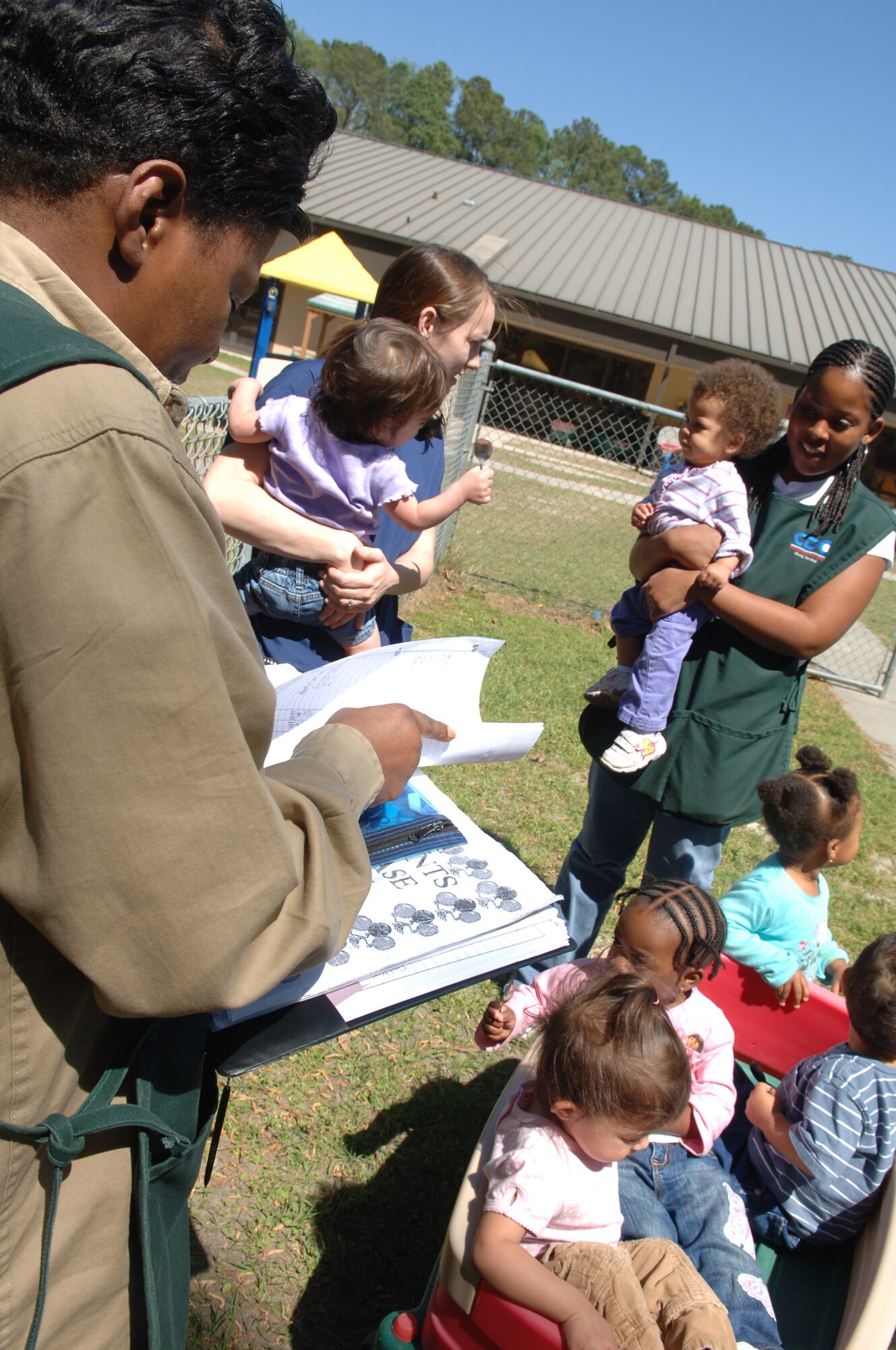 MOODY AIR FORCE BASE, Ga – Diane Murphy, 23rd Wing Child Development Center child development program assistant, takes accountability after a fire drill here Mar 20. They have just responded to an unexpected monthly fire drill. (U.S. Air Force Photo by Senior Airman Schelli Jones)