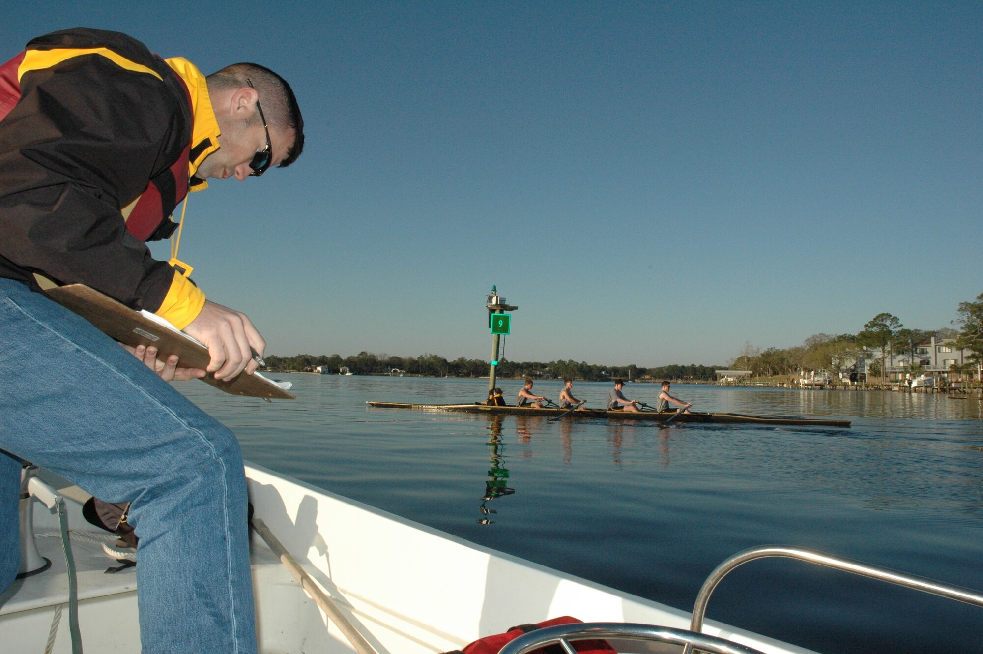 EGLIN AIR FORCE BASE, Fla. -- The United States Military Academy at West Point men's varsity crew team coach, Jeff Paine, rates the individuals on their performance and considers which members to switch. Coach Paine is trying to find the perfect combination for the varsity team. The teammates are vying against each other for a spot on the varsity crew team. Started in 1985, the crew team has been coming to Eglin for three years for spring break to practice their technique, speed and teamwork. (U.S. Air Force photo/ Staff Sgt. Stacia Zachary)