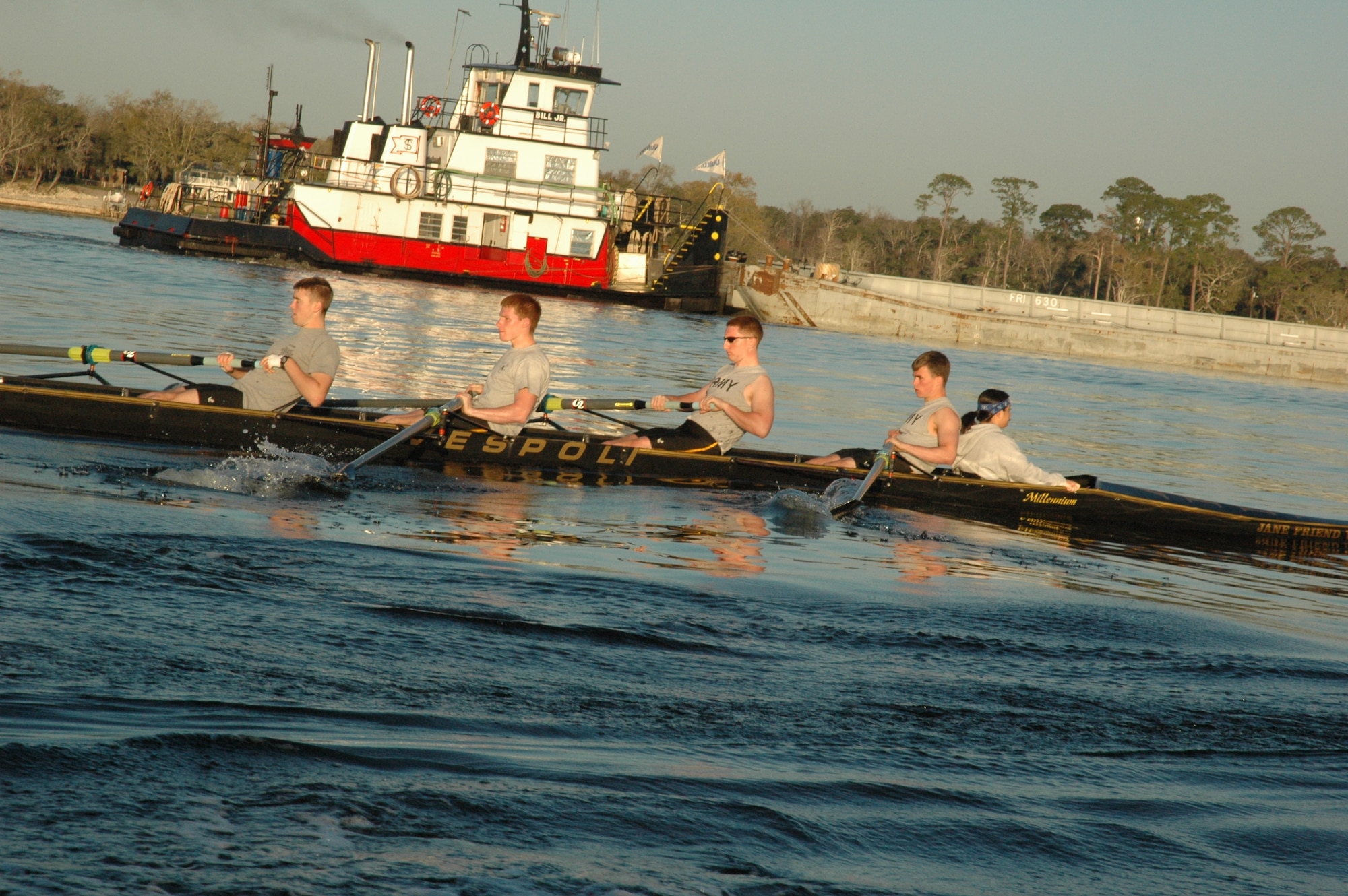 EGLIN AIR FORCE BASE, Fla. -- The United States Military Academy at West Point crew team practices for four-minute intervals on Boggy Bayou while their coxman guides them to their destination. The teammates are vying against each other for a spot on the varsity crew team. Started in 1985, the crew team has been coming to Eglin for three years for Spring Break to practice their technique, speed and teamwork. (U.S. Air Force photo/ Staff Sgt. Stacia Zachary)