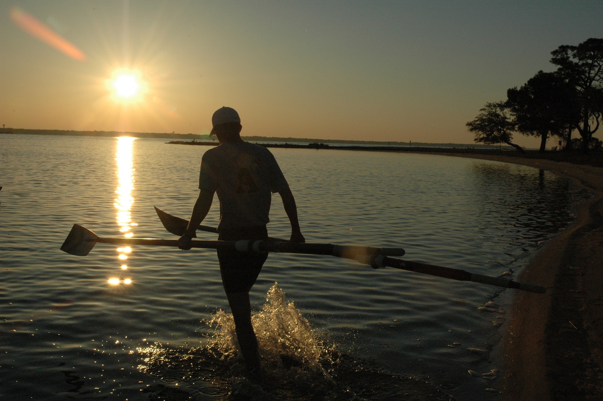 EGLIN AIR FORCE BASE, Fla. -- A member from the Army West Point Academy Male Crew Team takes oars out to the skulls on Boggy Bayou. Starterd in 1985, the crew team has been coming to Eglin for three years for Spring Break to practice their technique, speed and teamwork. (U.S. Air Force photo/ Staff Sgt. Stacia Zachary)