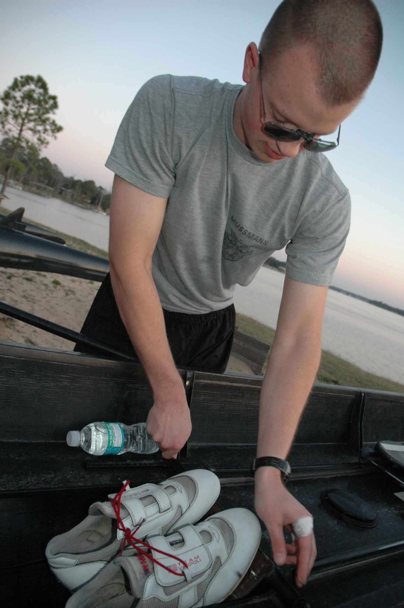 EGLIN AIR FORCE BASE, Fla. -- The United States Military Academy at West Point  Plebe Tom Mussman tightens down the wing nuts ensuring all the equipment is ready to be used prior to launching the skull into the Boggy Bayou. Started in 1985, the crew team has been coming to Eglin for three years for spring break to practice their technique, speed and teamwork. (U.S. Air Force photo/ Staff Sgt. Stacia Zachary)