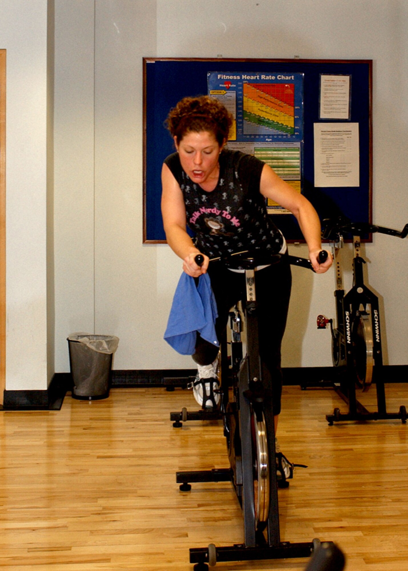 Staff Sgt. Sarah Lloyd, 48th Services Squadron NCOIC of special events, leads by example in a spin class for the Largest Loser program at RAF Lakenheath March 15. Sergeant Lloyd keeps herself and those she instrcts motivated as she works hard to stay in shape and help others acheive their fitness goals. (U.S. Air Force photo by Airman 1st Class Torri Ingalsbe)