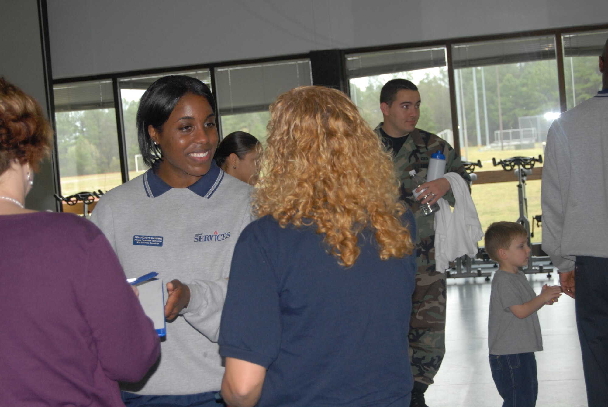 Senior Airman Jacklyn Hawkins, 43rd Services Squadron, recognizes contestants who participated in the Biggest Loser competition at the fitness center March 20. (U.S. Air Force Photo by Airman 1st Class Mindy Bloem)