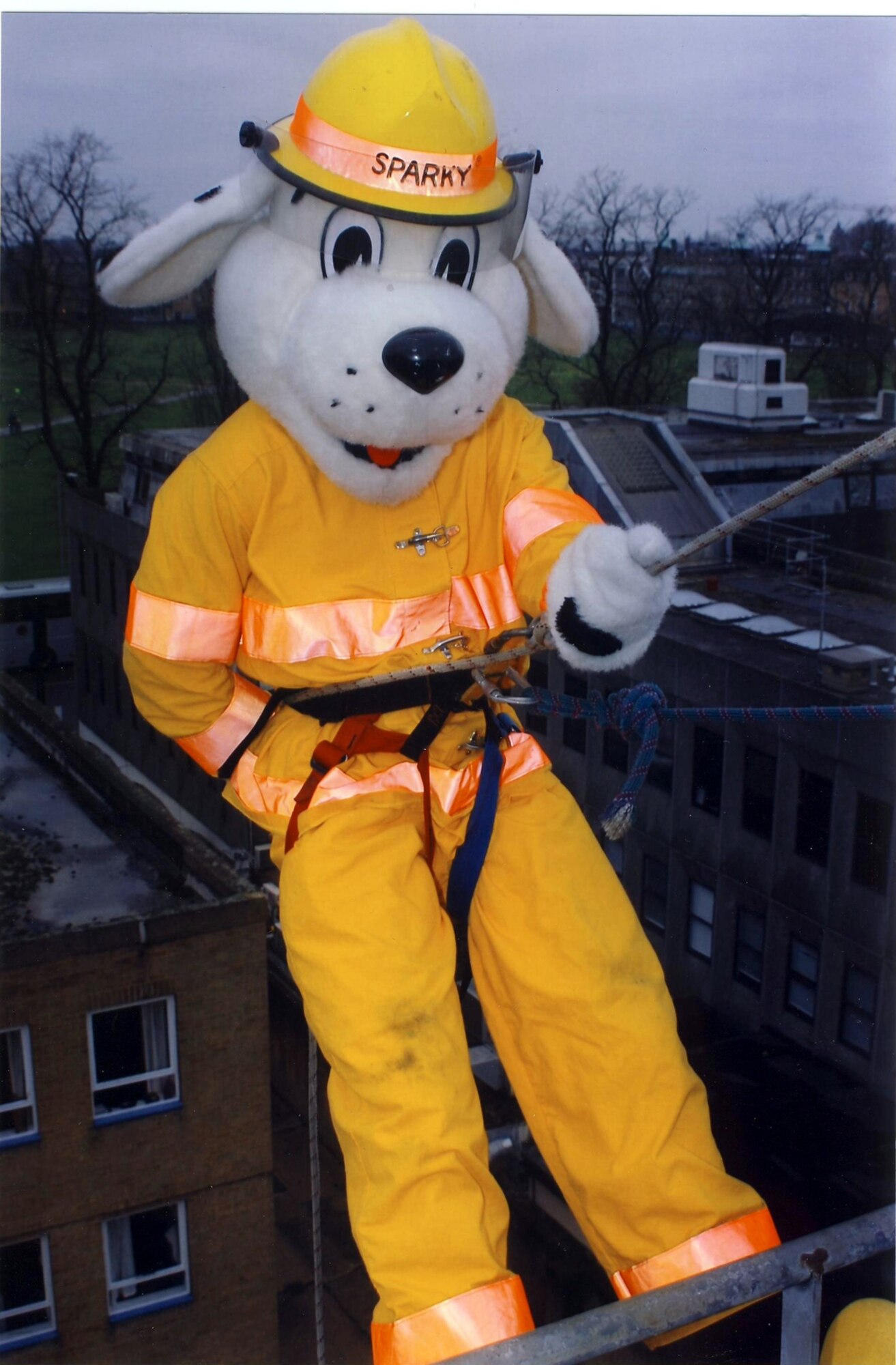 Staff Sgt. Sean Katz, 100th Civil Engineer Squadron fire Department, dressed as Sparky the Fire Dog before rappelling down an 80-foot tower at Cambridgeshire Fire Station March 16. He joined 19 British firefighters, from fire stations in the local area, to help raise money for a children's cancer charity. (Courtesy photo)