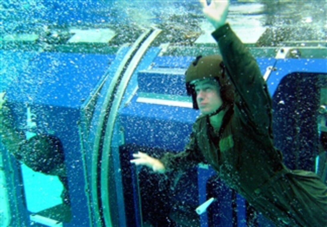 A U.S. Army soldier assigned to 25th Aviation Regiment's 2nd Battalion swims to the surface during egress training, Marine Corps Base Hawaii, March 20, 2008. The training teaches aviators and aircrew survival skills if an aircraft is immersed in water.  