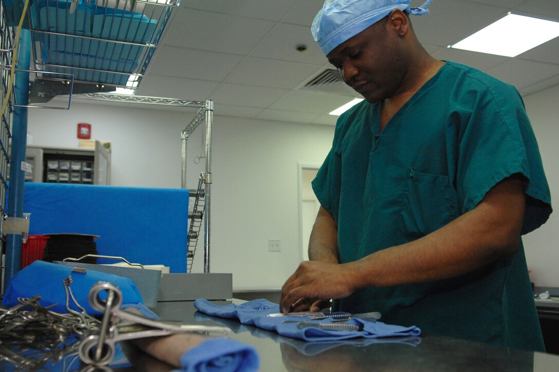 BALAD AIR BASE, Iraq -- Staff Sgt. Orondus Williams, 332nd Expeditionary Medical Operations Squadron surgical technician, wraps up an Air Force Theater Hospital surgical kit before placing it in a sterilizer here, March 19. The 332nd Expeditionary Medical Group runs the Air Force Theater Hospital here and provides a wide range of medical services to Airmen, Soldiers, Sailors and Marines throughout the Iraqi theater of operations. Sergeant Williams is deployed from Langley Air Force Base, Va. (U.S. Air Force photo/ Senior Airman Julianne Showalter)