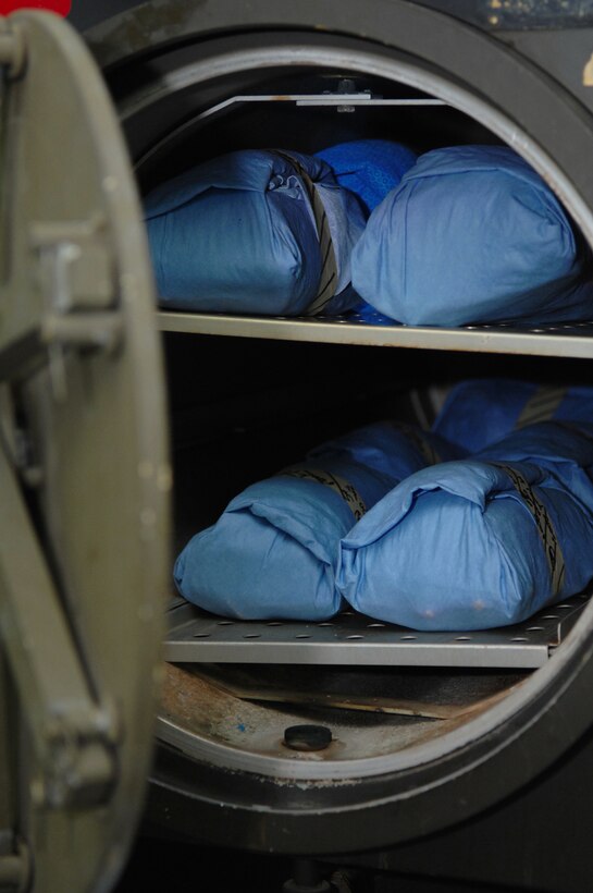 BALAD AIR BASE, Iraq -- The medical tool sterilization process is conducted in two steps. Tools are first placed in an ultrasonic bath and then are wrapped and placed in the sterilizer. The 332nd Expeditionary Medical Group runs the Air Force Theater Hospital here and provides a wide range of medical services to Airmen, Soldiers, Sailors and Marines throughout the Iraqi theater of operations. The hospital is the equivalent of a level one trauma center; more than 1,200 patients are seen by medical personnel each month, of which more than 650 are trauma cases. (U.S. Air Force photo/ Senior Airman Julianne Showalter)