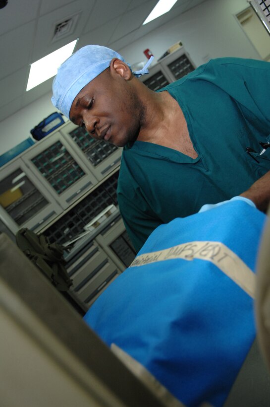 BALAD AIR BASE, Iraq -- Staff Sgt. Orondus Williams, 332nd Expeditionary Medical Operations Squadron surgical technician, puts a surgical kit into a sterilizer for 30 minutes here, March 19. The sterilization clinic is responsible for keeping all Air Force Theater Hospital tools sterile. The hospital staff treats wounded and sick coalition force servicemembers, as well as local citizens and third country nationals. Sergeant Williams is deployed from Langley Air Force Base, Va. (U.S. Air Force photo/ Senior Airman Julianne Showalter)