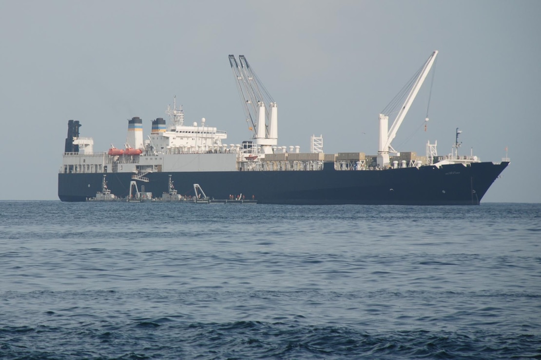 The Roll-on/Roll-off Discharge Facility, part of the Navy's new Improved Navy Lighterage System, moors off the USNS Lance Cpl. Roy Wheat, a maritime prepositioning ship participating in West African Training Cruise 2008. The INLS will be used to transfer Marines and vehicles between multiple naval platforms during the exercise.