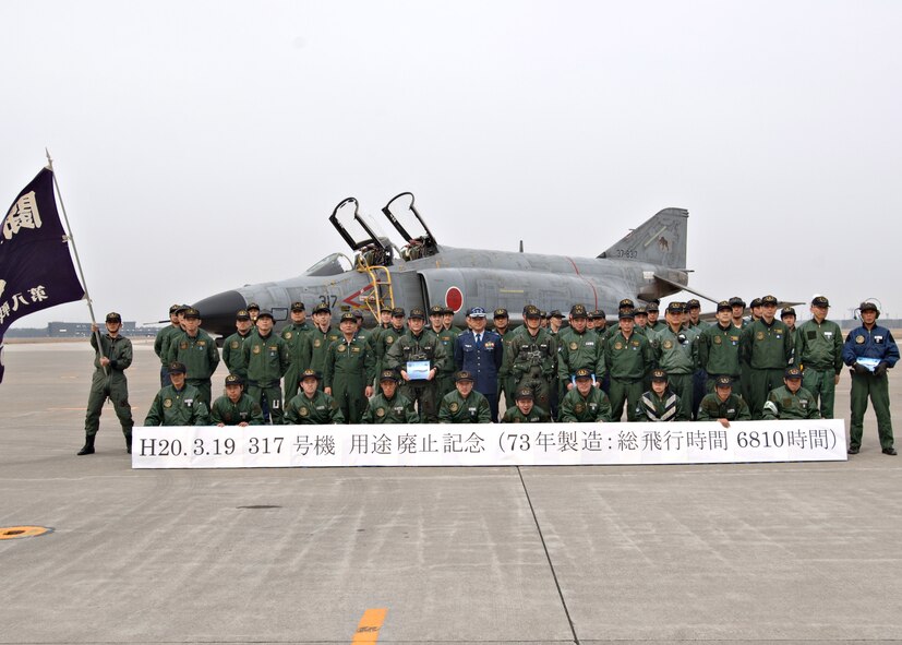 MISAWA AIR BASE, Japan -- The members of Japan Air Self Defense
Force's 8th Fighter Squadron line up in formation honoring the newly
decommissioned F-4 on March 19, 2008. The F-4 was the first of its kind
to be decommissioned at Misawa AB. (U.S. Air Force photo by Airman 1st Class Christopher Bevins)
