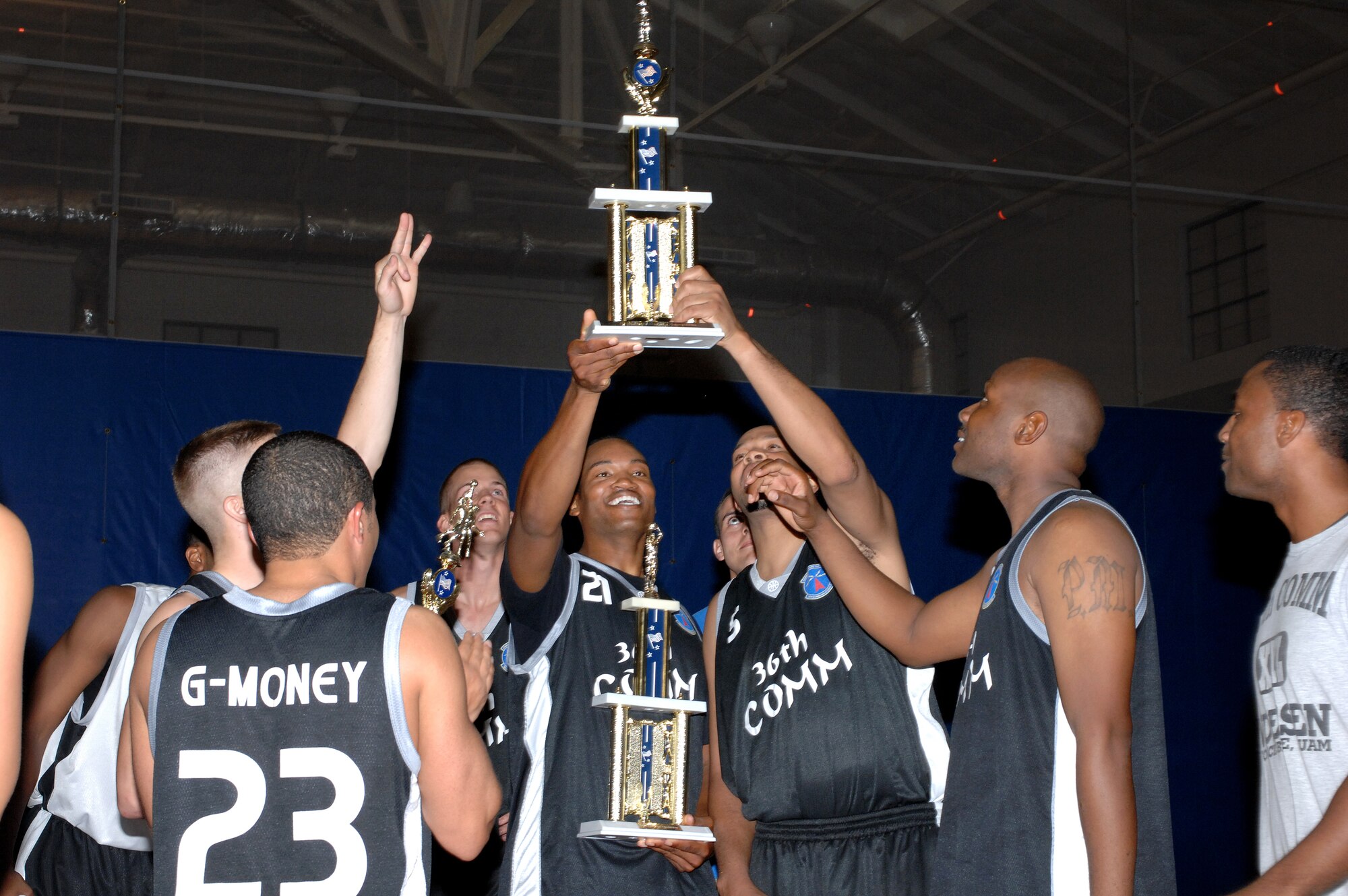 Members of the 36th Communications Squadron intramural basketball team hold up the 2008 Intramural Basketball Championship trophie after defeating the 554th RED HORSE Squadron 55-39 on March 24.  (Photo by Senior Airman Miranda Moorer/36th Wing Public Affairs) 