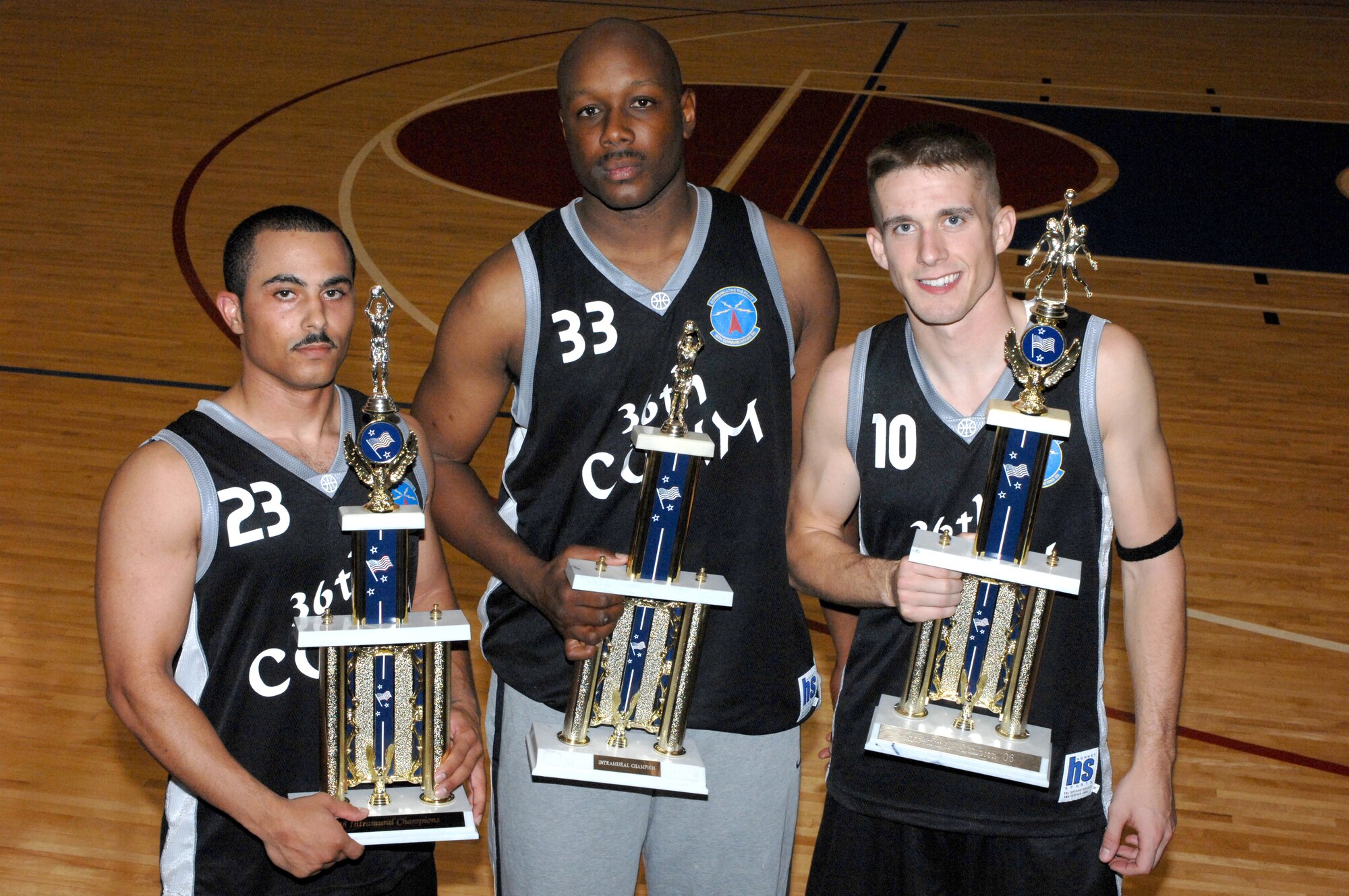 Staff Sgts. Gregory Moorer and Patrick Mitchell, and Airman 1st Class Matthew Gainer have been crucial pieces in helping the 36th Communications Squadron's intramural basketball team win the base championship for three consecutive years. The trio are the only members to have played with the team for all three winning seasons. (Photo by Senior Airman Miranda Moorer/36th Wing Public Affairs) 

          