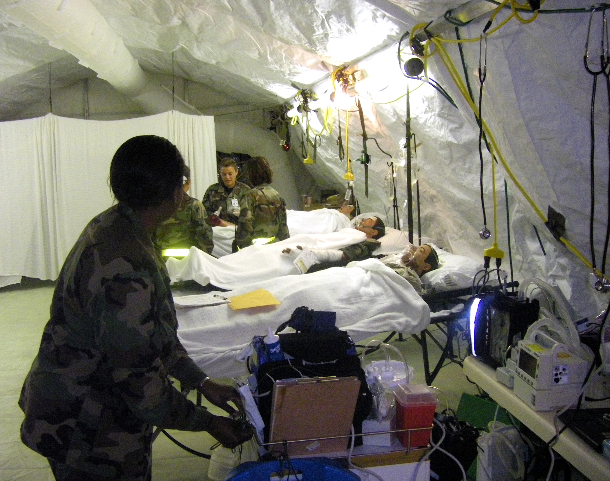 Contingency Aeromedical Staging Facility personnel at Pacific Lifeline 2008, a joint-service exercise at Barking Sands Pacific Missile Range, Kauai, Hawaii, care for simulated patients after being trained by the 381st Training Squadron's CASF Mobile Training Course. The couse is the first of its type to be certified by both Air Education and Training Command and Air Mobility Command. (U.S. Air Force photo)