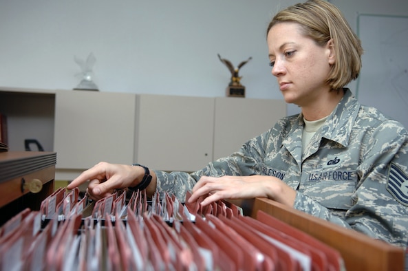 Tech. Sgt. Diane Burleson, 355th Fighter Wing Inspections, Plans and Programs, reviews personal readiness folders at the Fighter Wing Headquarters building here, March 5. Sergeant Burleson is the Fighter Wing Staff Unit Deployment Manager and makes sure personnel are prepared to deploy when called. (U.S. Air Force photo/Airman 1st Class Noah R. Johnson)