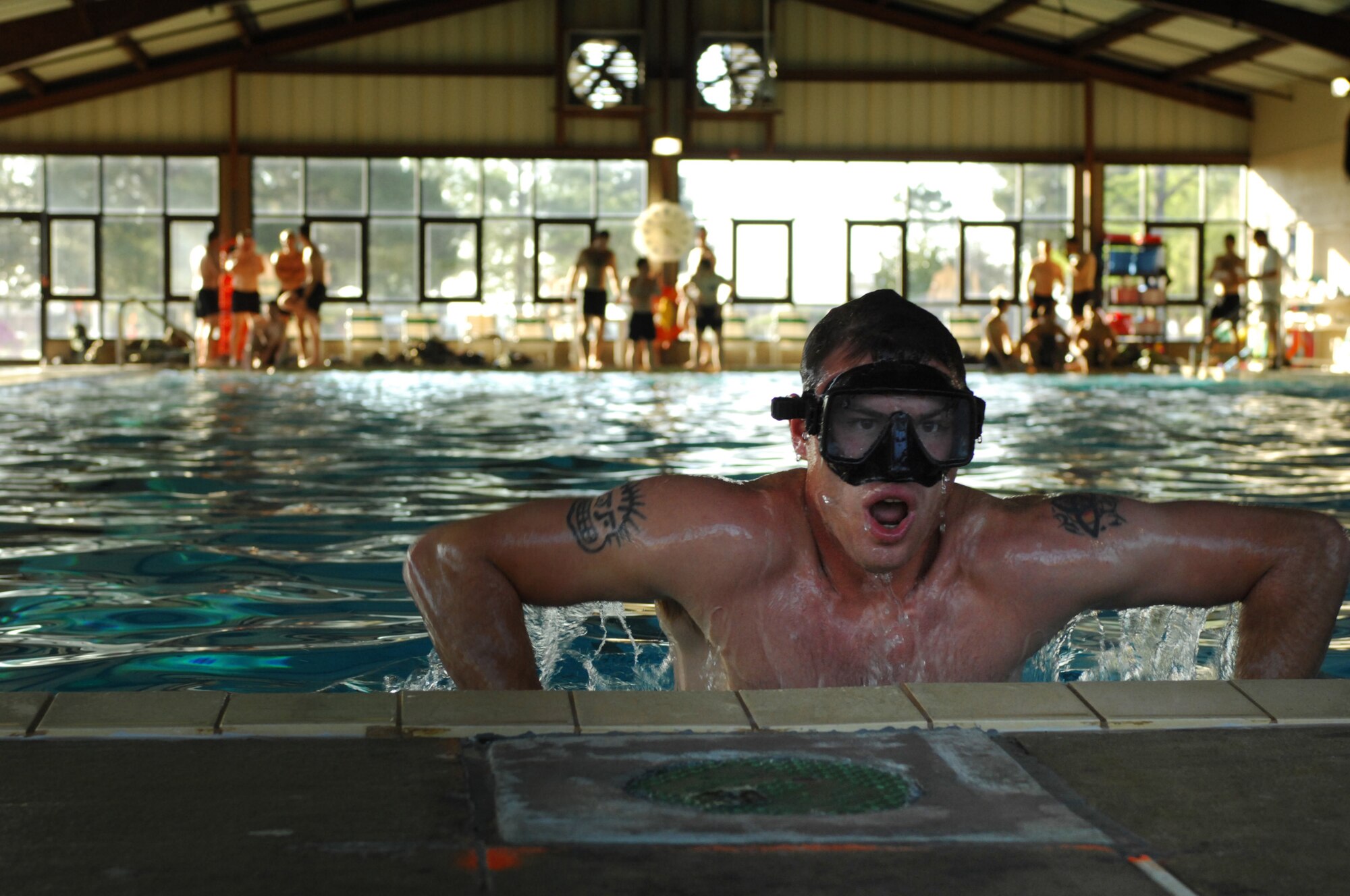 MOODY AIR FORCE BASE, Ga. -- Senior Airman Mark McHan, a pararescueman with the 38th Rescue Squadron here, exits the pool during an underwater drill which is part of the Inaugural Maltz/Plite Monster Mash. The Monster Mash is an annual team-building competition that tests skills and endurance. It also pays tribute to two pararescuemen killed in action in Afghanistan March 23, 2003,  both of whom were assigned to the 38th RQS. (U.S. Air Force photo by Staff Sgt. Joshua T. Jasper) 