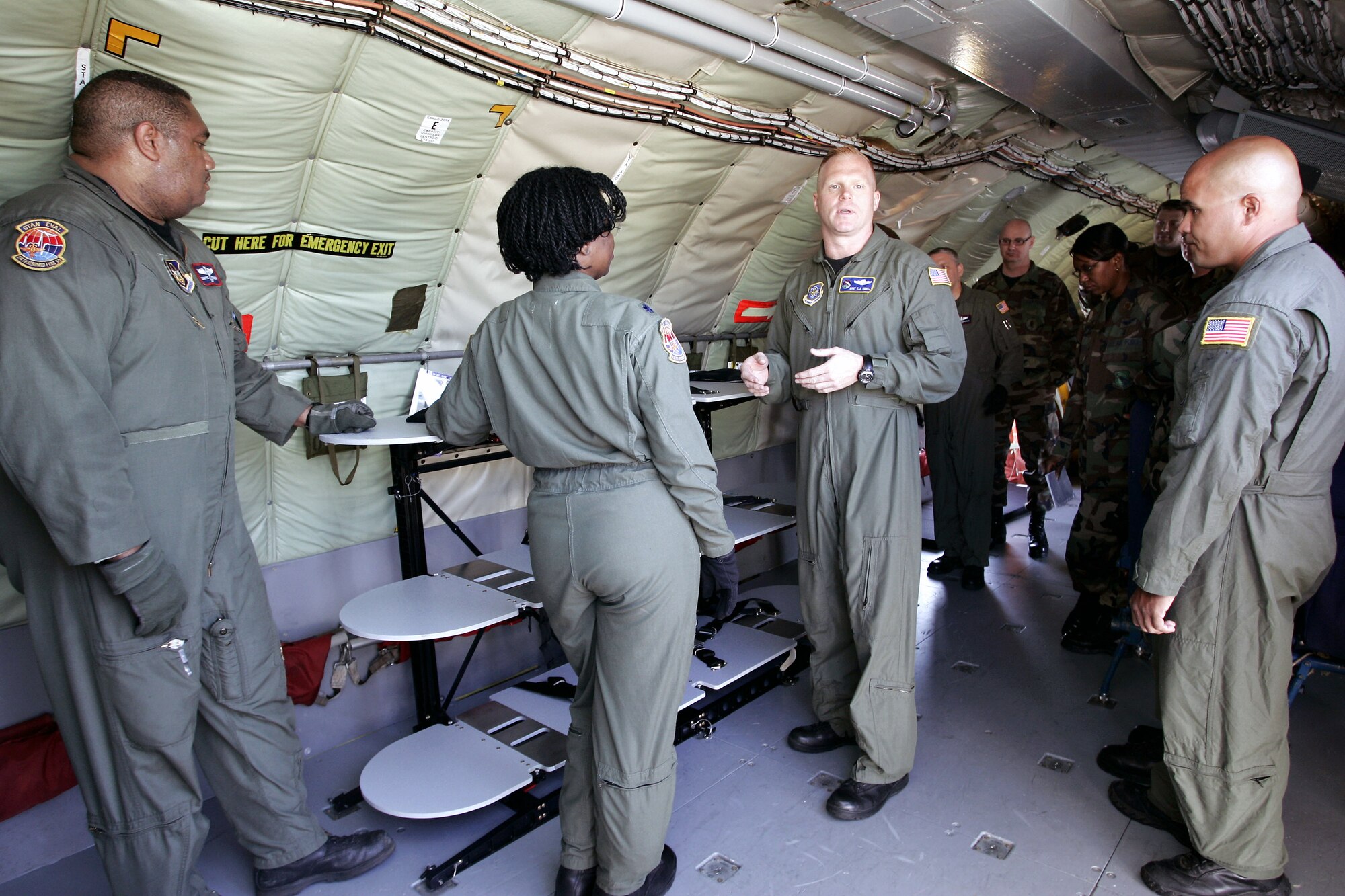 Master Sgt. Chris Sidoli (center) works with KC-135 Stratotanker aircrew members during a demonstration for the stacking litter system initiative June 22 at McGuire Air Force Base, N.J. The versatile and portable system will allow a more flexible aeromedical evacuation system. Sergeant Sidoli works at the Air Mobility Battlelab. The aircrew members are from the 108th Air Refueling Wing at McGuire AFB. The Air Mobility Battlelab is located in the U.S. Air Force Expeditionary Center on Fort Dix, N.J. (U.S. Air Force Photo/Master Sgt. Bob Lorusso) 
