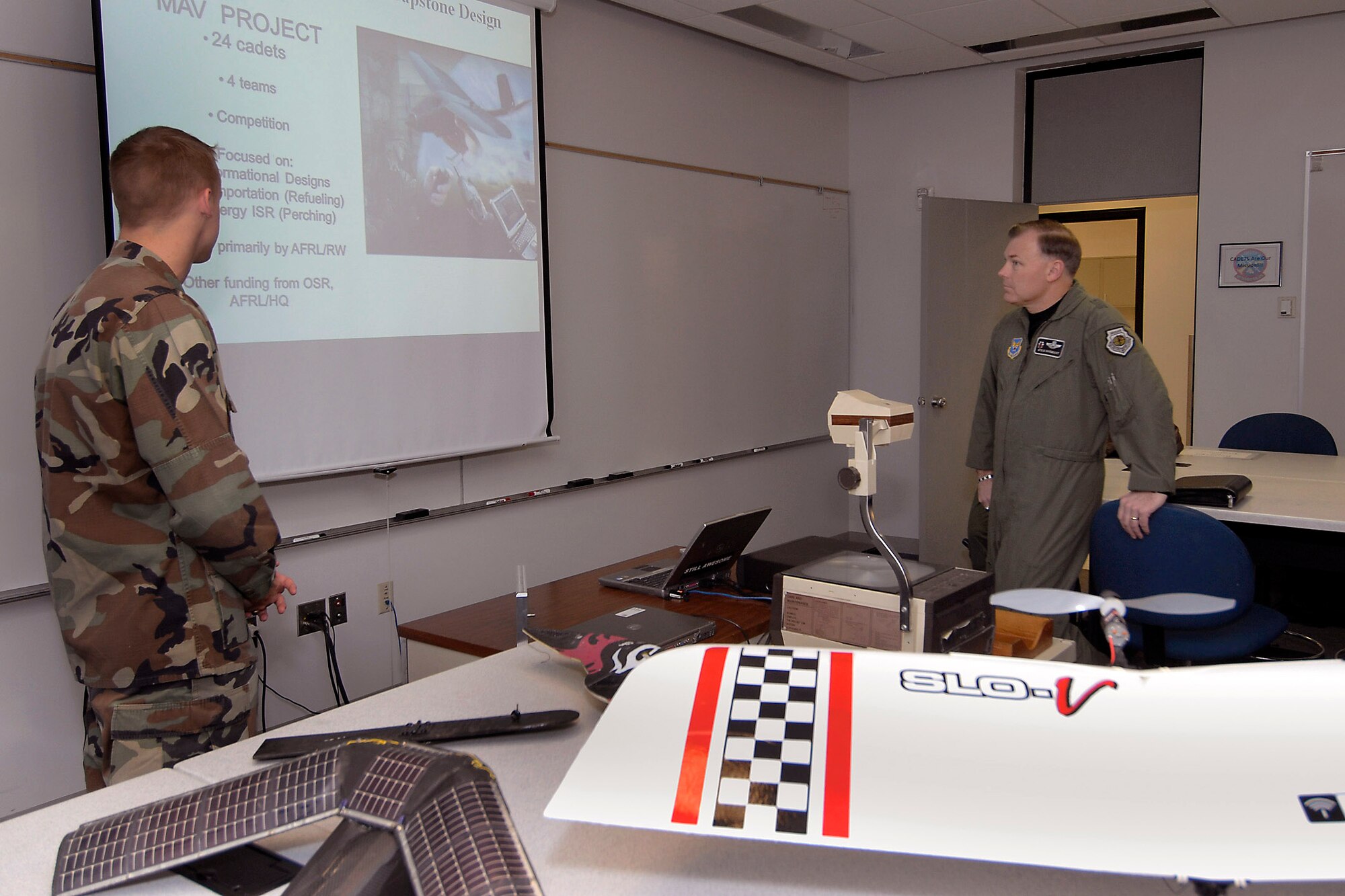 Maj. Gen. Stephen T. Sargeant (right) listens to a U.S. Air Force Academy cadet's captone briefing during a March 17 at the Academy in Colorado Springs, Colo. General Sargeant is the Air Force Operational Test and Evaluation Center commander from Kirtland Air Force Base, N.M. (U.S. Air Force photo) 
