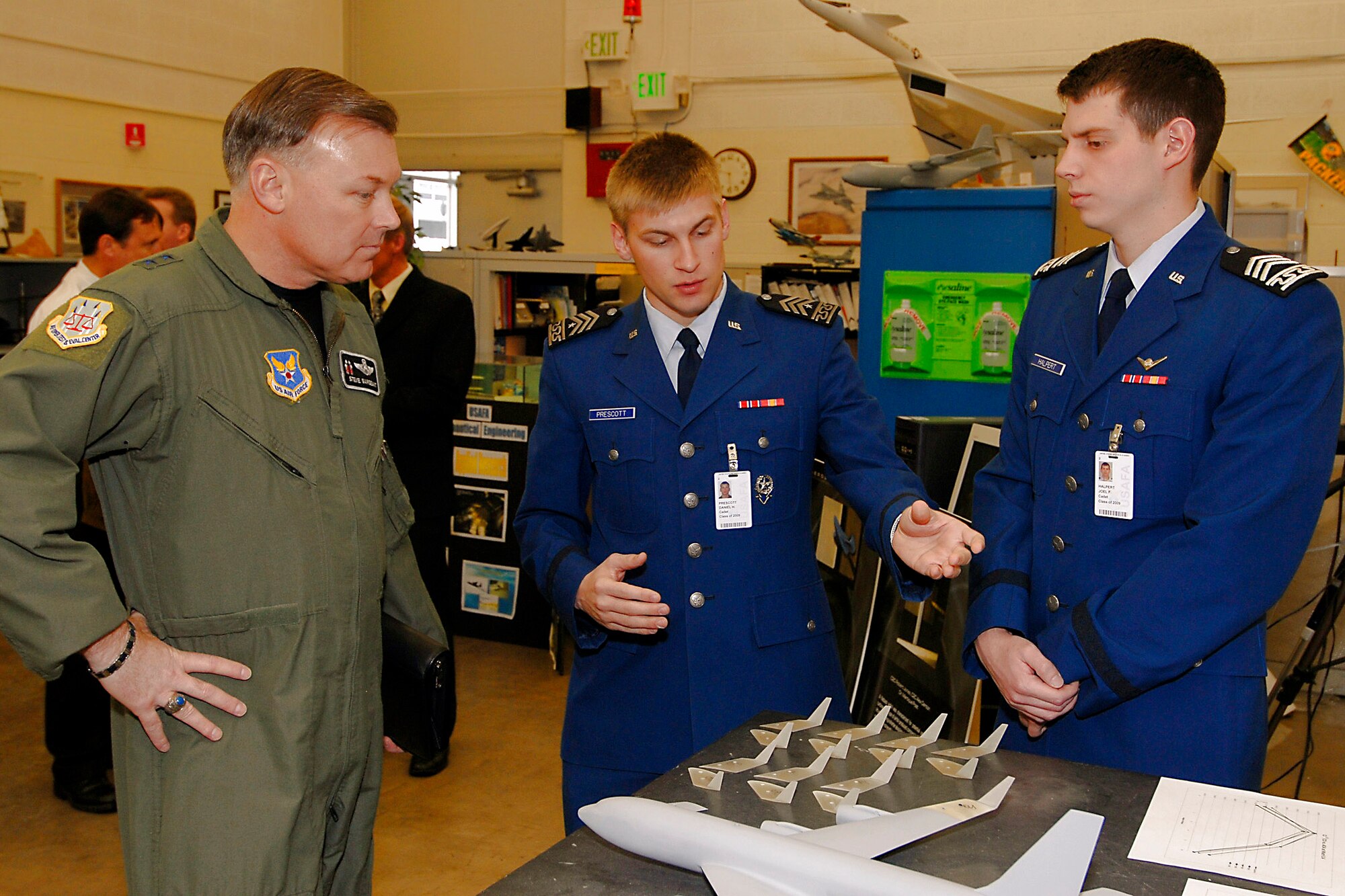 Maj. Gen. Stephen T. Sargeant (from left) listens as U.S. Air Force Academy cadets explain what they are working on during his tour of Academy astronatutics classes and laboratories March 17 at the Academy in Colorado Springs, Colo. General Sargeant is the Air Force Operational Test and Evaluation Center commander from Kirtland Air Force Base, N.M. (U.S. Air Force photo) 
