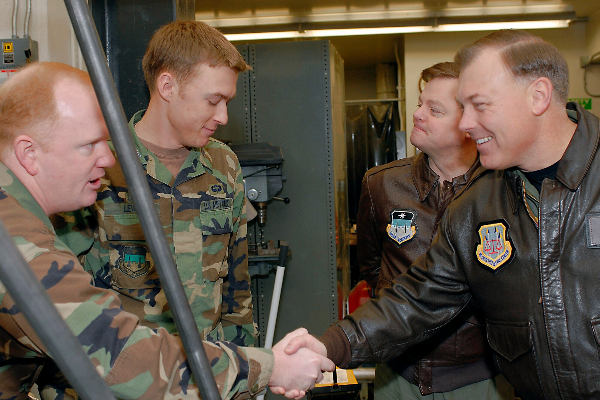 Maj. Gen. Stephen T. Sargeant (right) meets and visits with U.S. Air Force Academy cadets during a March 17 visit that included a tour of Academy astronautics classes and laboratories at the Academy in Colorado Springs, Colo. General Sargeant is the Air Force Operational Test and Evaluation Center commander from Kirtland Air Force Base, N.M. (U.S. Air Force photo) 
