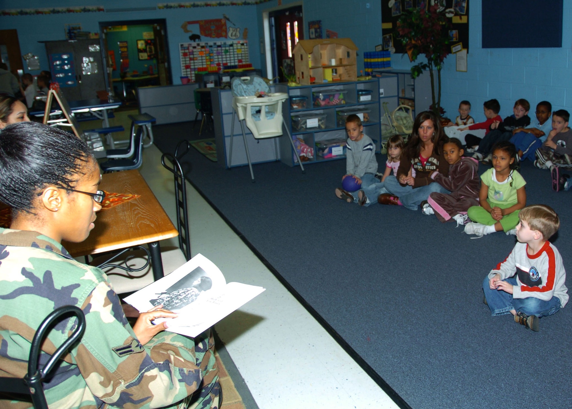 ALTUS AIR FORCE BASE, Okla. -- Airman 1st Class Antonia Scott, Logistics Readiness Squadron, reads a book to children during a Women's History Month Read-a-thon event at the Youth Center March 19. There will be a lucheon in honor Women's History Month at Club Altus March 28 from 11:30 to 1 p.m. (U.S. Air Force photo by Airman 1st Class Marianne Lane)