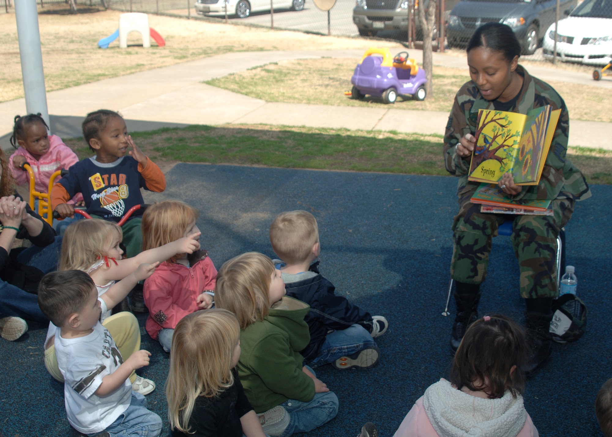 ALTUS AIR FORCE BASE, Okla. -- Staff Sgt. Michelle Johnson, 54th Air Refueling Squadron, reads a book to children during a Women's History Month Read-a-thon event at the Child Developement Center March 19. (U.S. Air Force photo by Airman 1st Class Amanda Bower)