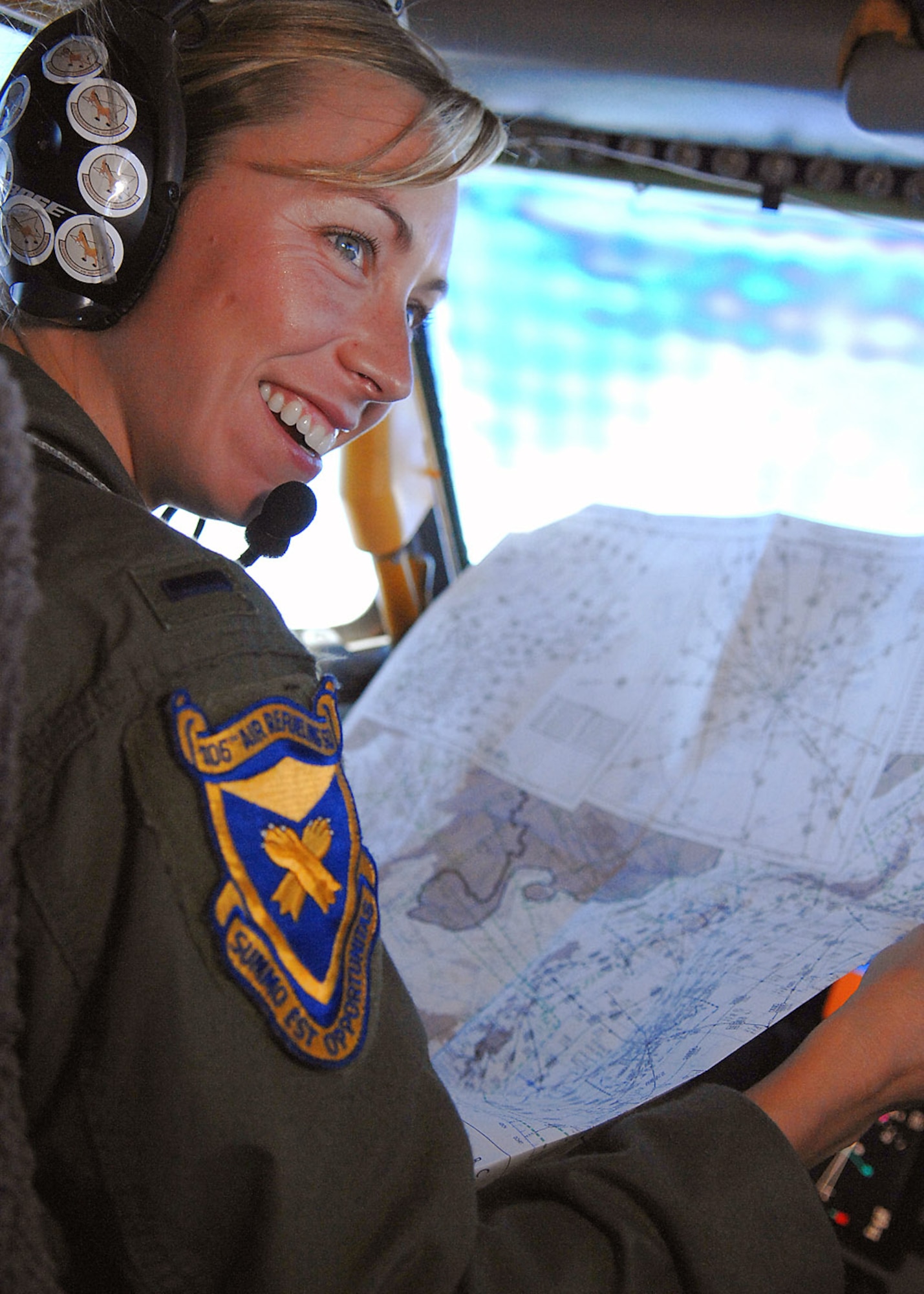 1st Lt. Lauren Diskell reads an aerial map while flying her KC-135 Stratotanker during a practice aerial refueling mission March 19 near the Mariana Islands. KC-135s refuel the B-52 Stratofortressess that support the U.S. continuous bomber presence in the Pacific region. Lieutenant Diskell is deployed from the 106th Air Refueling Squadron of the Alabama Air National Guard. (U.S. Air Force photo/Staff Sgt. Vanessa Valentine) 
