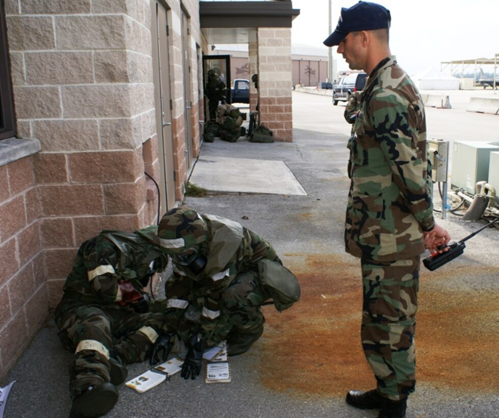 2nd Lt. Robert Lax, 482nd Mission Support Squadron, offers assistance to two Homestead reservists practicing self-aid buddy care during the Operational Readiness Exercise March 8-11. Lieutenant Lax served as a member of the Exercise Evaluation Team, which helped facilitate learning during the exercise that featured realistic war time scenarios. (U.S. Air Force photo/Tim Norton)