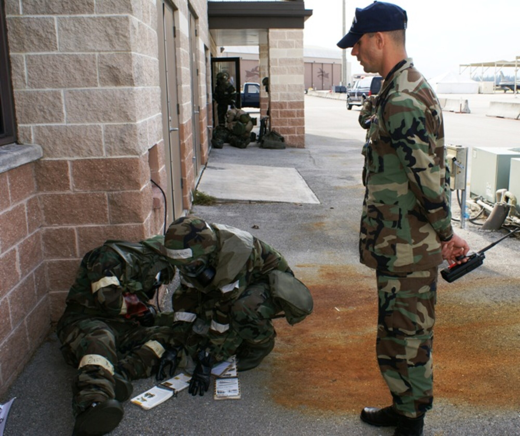 2nd Lt. Robert Lax, 482nd Mission Support Squadron, offers assistance to two Homestead reservists practicing self-aid buddy care during the Operational Readiness Exercise March 8-11. Lieutenant Lax served as a member of the Exercise Evaluation Team, which helped facilitate learning during the exercise that featured realistic war time scenarios. (U.S. Air Force photo/Tim Norton)