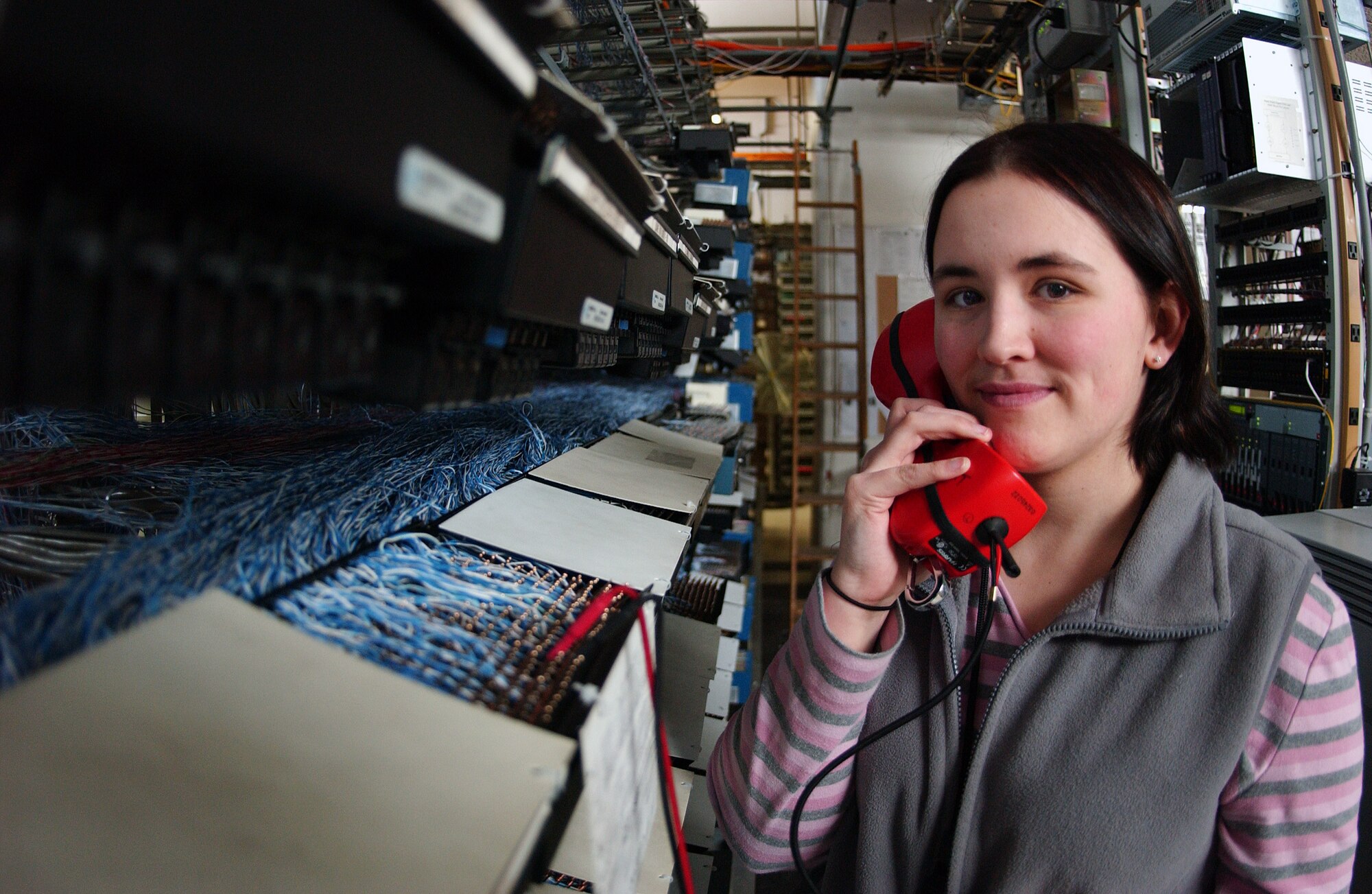 Kasey Banning of the Telephone Switch System Maintenance Shop uses a telephone test set checking the dial tone quality of the phone line March 21 at Eielson Air Force Base, Alaska. All telephone, modems, fax, videoteleconference, and giant voice lines throughout base are maintained in this location. (U.S. Air Force Photo/Airman 1st Class Jonathan Snyder) (Released)