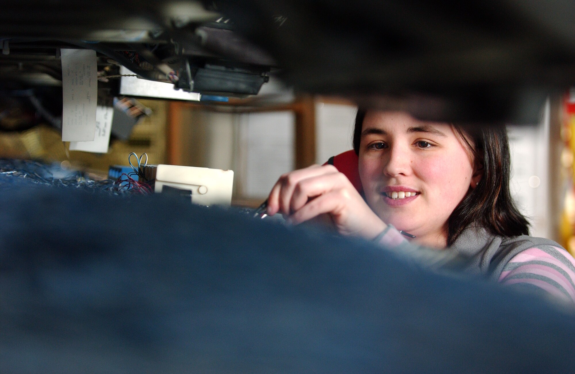 Kasey Banning of the Telephone Switch System Maintenance Shop uses a telephone test set checking the dial tone quality of the phone line March 21 at Eielson Air Force Base, Alaska. All telephone, modems, fax, videoteleconference, and giant voice lines throughout base are maintained in this location. (U.S. Air Force Photo/Airman 1st Class Jonathan Snyder) (Released)