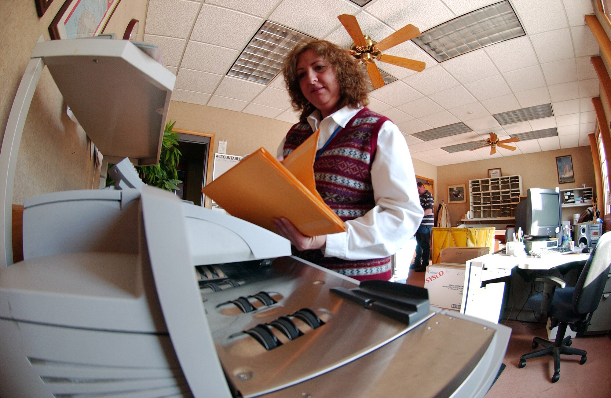 Brenda Medina of the Official Mail Center sorts through official mail parcel March 21 at Eielson Air Force Base, Alaska. They provide services for receiving, processing distributing, and dispatching official and accountablemail, administrative communications, forms, publications, parcels and distribution for all base-supported activities. (U.S. Air Force Photo/Airman 1st Class Jonathan Snyder) (Released)