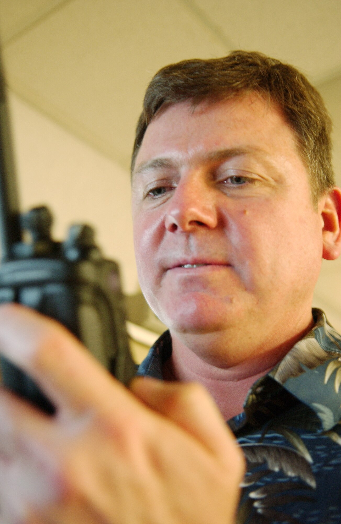 Elvin Sprankle with Personal Wireless Communications Systems Shop programs a land mobile radio ensuring it will operate correctly when communicating with other radio's March 21 at Eielson Air Force Base, Alaska. PWCS Shop performs frequency assignments, spectrum certification, interference reports, and interference analysis to support all LMR needs. (U.S. Air Force Photo/Airman 1st Class Jonathan Snyder) (Released)