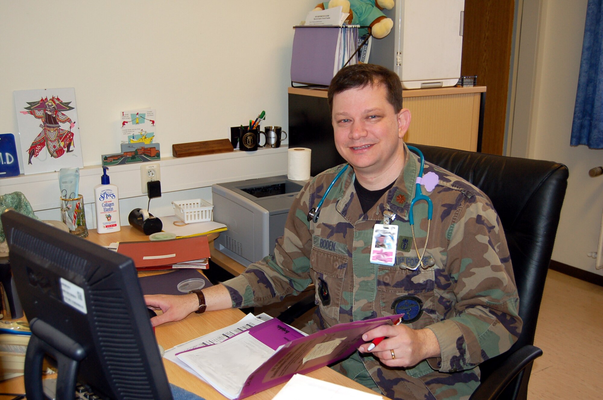SPANGDAHLEM AIR BASE, Germany – Dr. (Maj.) Stephen Boden, 52nd Medical Operations Squadron, reviews files. Dr. Boden said that he believes being able to help parents as they take care of their children is the most rewarding part of his job. National Doctor’s Day takes place March 30, 2008. (U.S. Air Force photo/Staff Sgt. Tammie Moore)