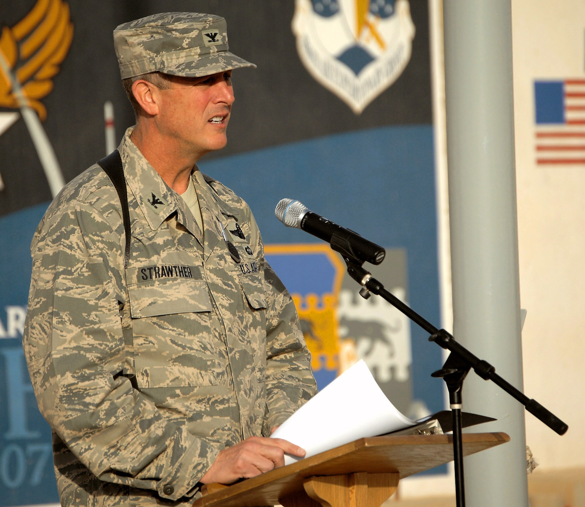 Col. Timothy Strawther recites the names of the 42 Airmen who gave the ultimate sacrifice during Operation Iraqi Freedom March 20 at Kirkuk Air Base, Iraq. The speech was part of an event to commemorate the fifth anniversary of Operation Iraqi Freedom. Colonel Strawther is the 506th Air Expeditionary Group commander. (U.S. Air Force photo/Senior Airman SerMae Lampkin) 
