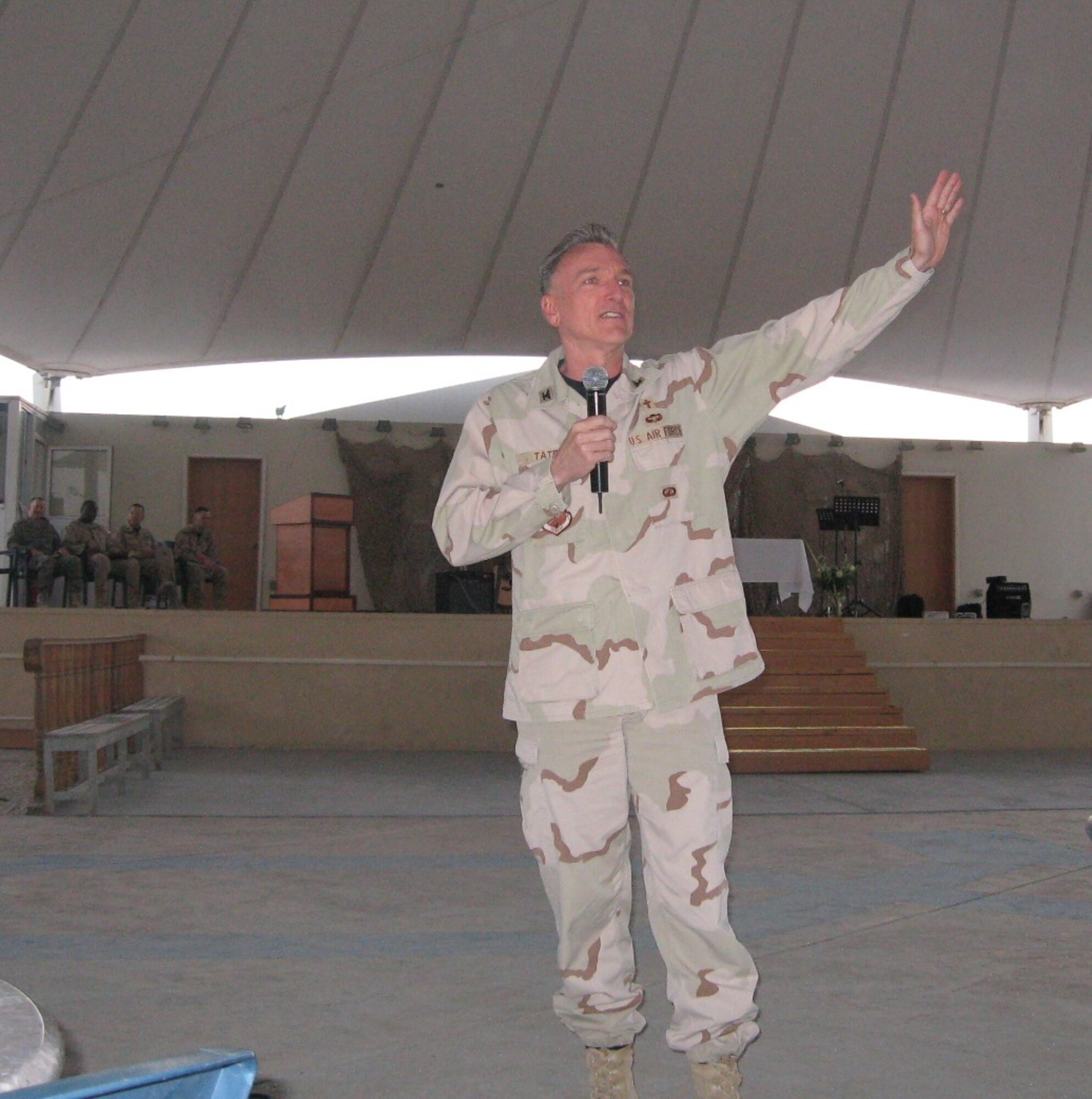 Chaplain (Col.) Gregory Tate the U.S. Air Forces Central Command Chaplain, delivers the Easter sunrise service message at a Southwest Asia air base March 23.  More than 100 service members attended the special event. (Courtesy photo)
