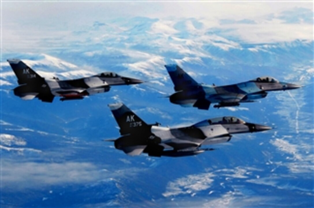 Three F-16 Fighting Falcons fly in formation over the Pacific Alaska Range Complex, March 20, 2008, prior to a combat training mission. The Falcons are from the 18th Aggressor Squadron assigned to Eielson Air Force Base, Alaska.