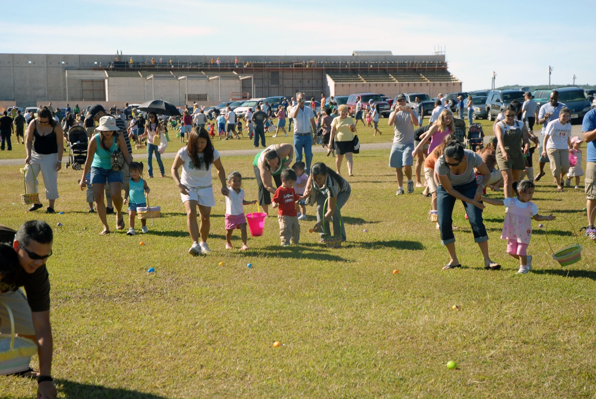 Team Andersen members make a mad dash for Easter eggs during the base Easter egg hunt March 22 at Arc Light Park. (Courtesy photo)