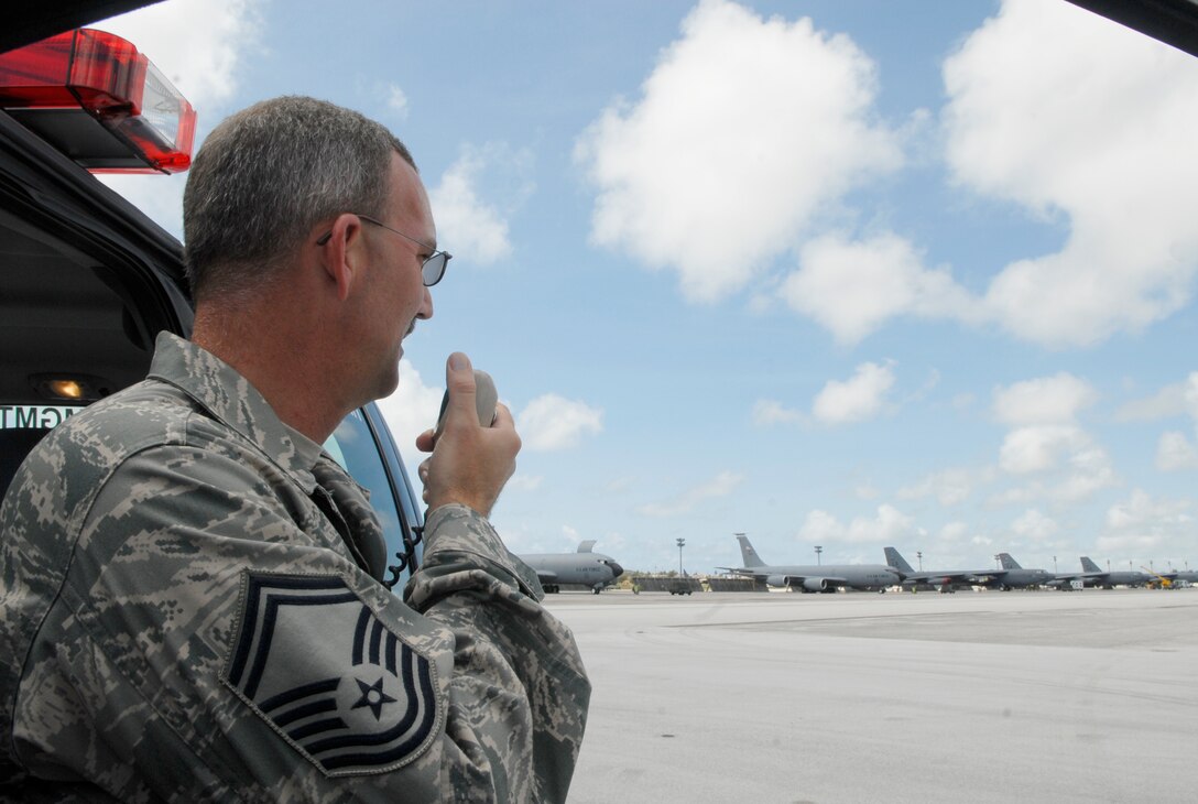 Senior Master Sgt. Darron Williams, 36th Operations Support Squadron Airfield manager, overlooks Andersen's flightline March 25. Sergeant Williams was recently named the Pacific Air Force's Airfield Management Senior NCO of the Year. A few of Sergeant Williams' accomplishments are guiding an airfield overhaul plan that minimized the impact to Andersen's airfield, completed eight airfield improvement projects valued at more than $38 million managed a new runway opening ceremony.  (U.S. Air Force photo by Airman Class 1st Nichelle Griffiths)