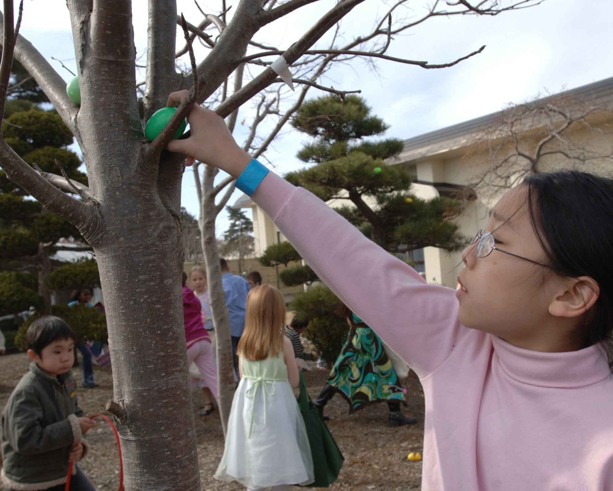MISAWA AIR BASE, Japan -- Children find hidden Easter eggs during the base Easter egg hunt on March 23, 2008.  The Easter egg hunt took place at the officer's club and was available for club members.   (U.S. Air Force photo by Senior Airman Robert Barnett)