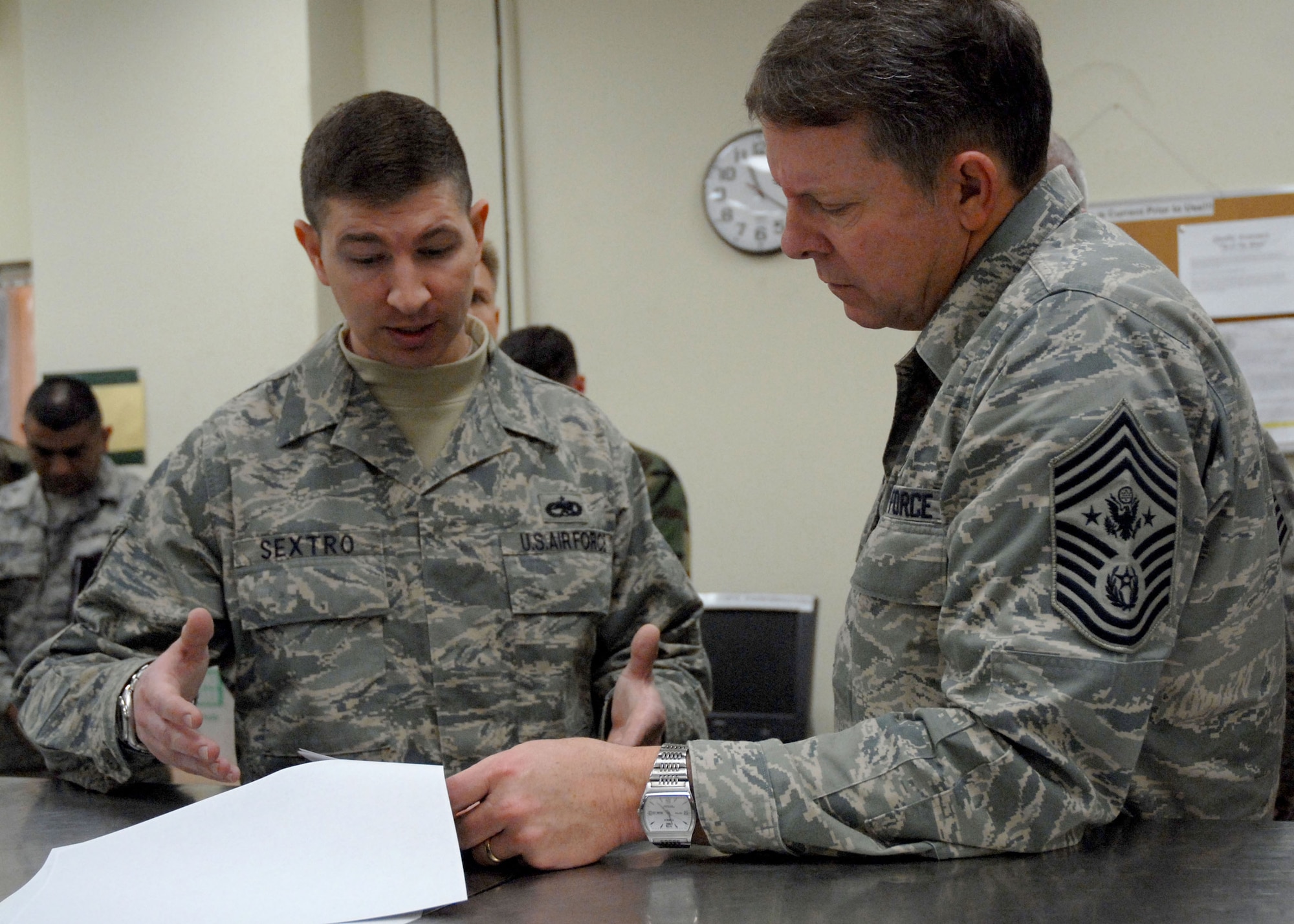 KUNSAN AIR BASE, Republic of Korea— Technical Sergeant Michael Sextro, 8th Aircraft Maintenance Squadron, briefs Chief Master Sergeant of the Air Force Rodney J. McKinley about Intake Rippling on F-16s here during the chief’s visit to the base March 24. (U.S. Air Force photo/Staff Sgt. Araceli Alarcon)                                